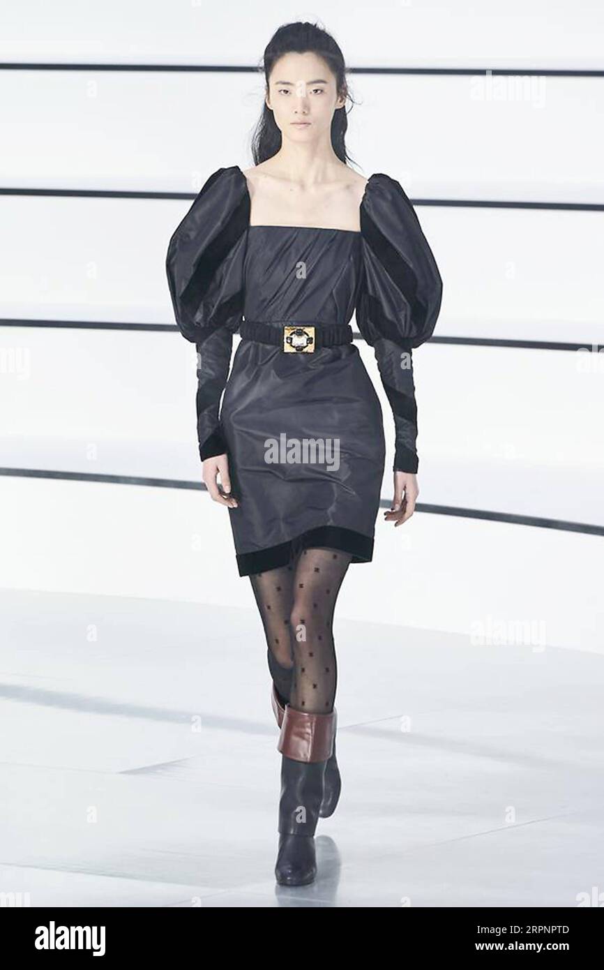 200303 -- PARIS, March 3, 2020 Xinhua -- A model presents a creation by Louis  Vuitton during the Women s Fall/Winter 2020-2021 Ready-to-Wear collection  fashion show in Paris, France, on March 3
