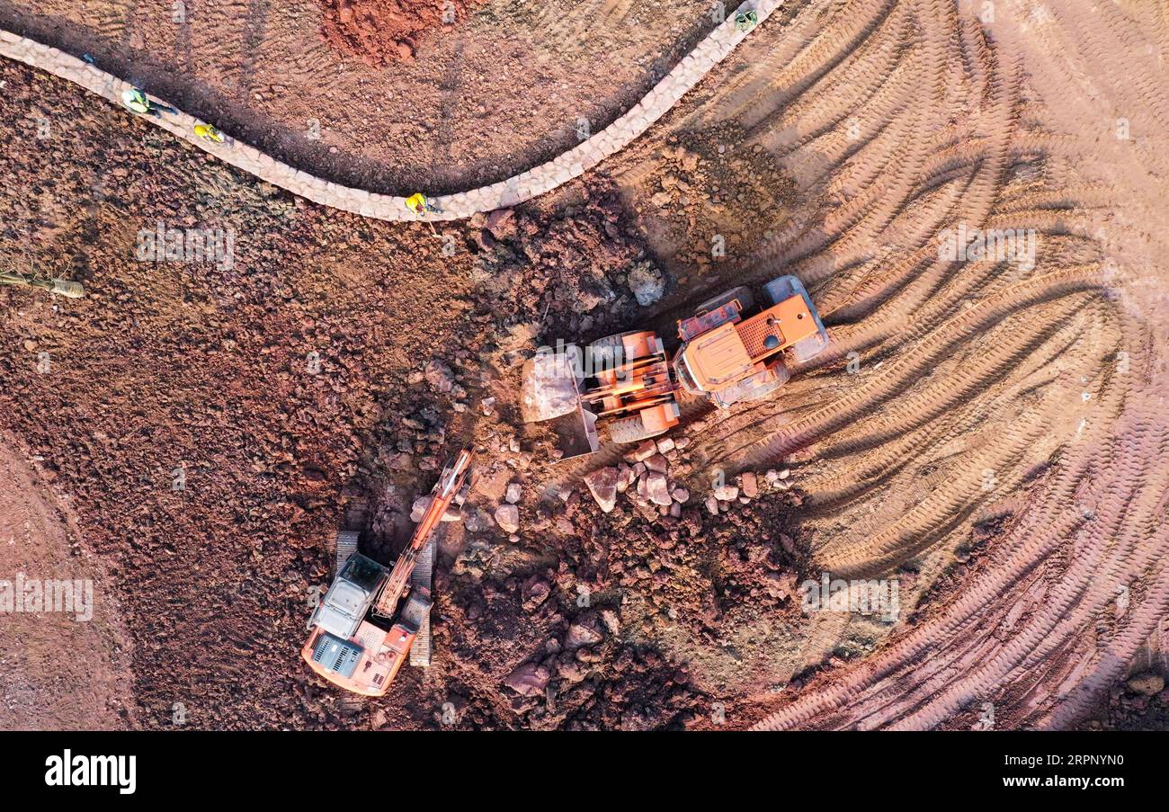 200307 -- CHONGQING, March 7, 2020 -- Aerial photo taken on March 6, 2020 shows workers working at the site of the ecological restoration project at Guangyang Isle of Nan an District, southwest China s Chongqing. A series of ecological restoration measures have been taken to restore the island s flora to more than 430 species, and provide habitat for more animals in order to form a good natural ecological environment system here.  CHINA-CHONGQING-GUANGYANG-RESTORATION CN WangxQuanchao PUBLICATIONxNOTxINxCHN Stock Photo