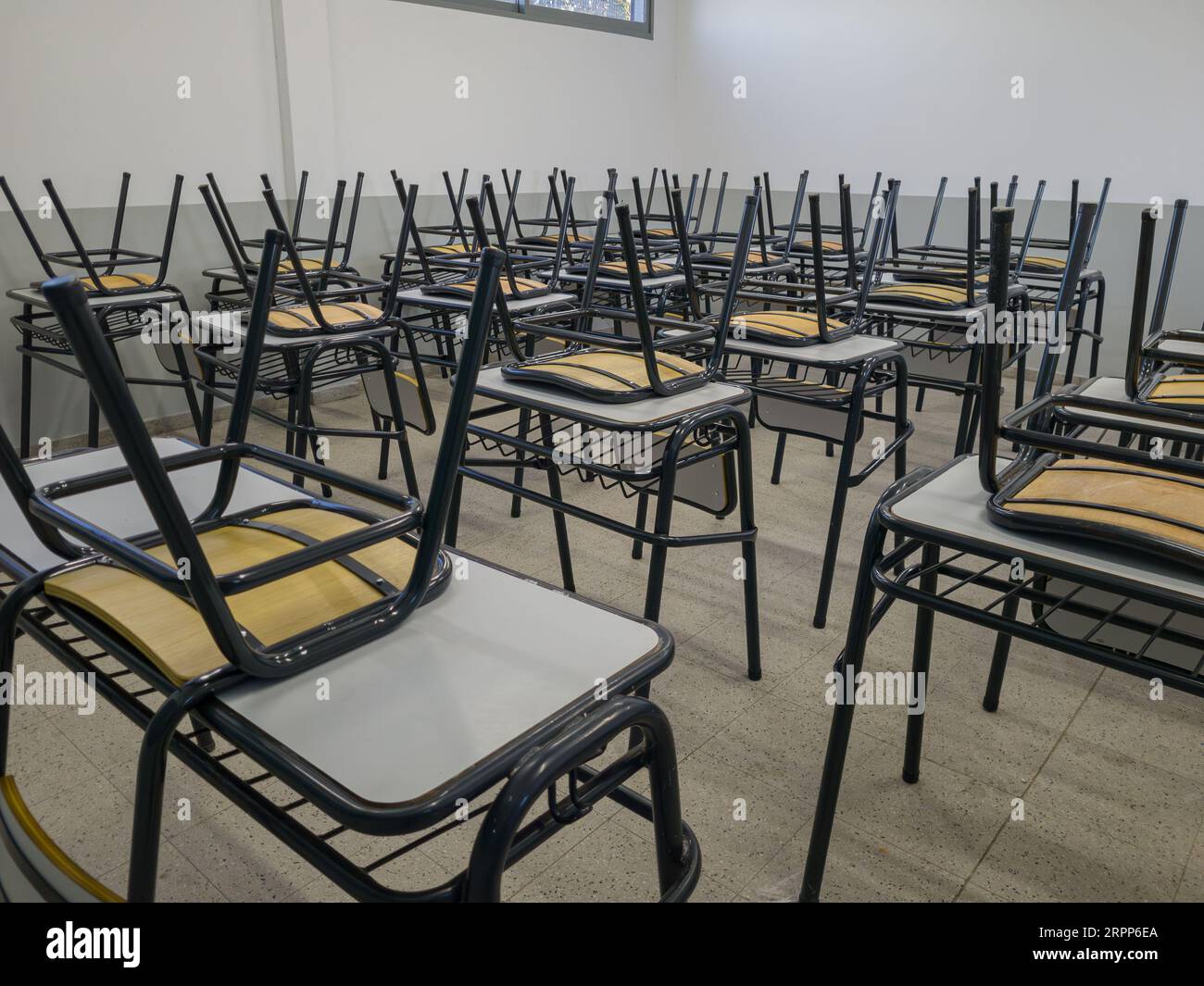 Empty tables and chairs in a school. Teacher strike concept. Stock Photo