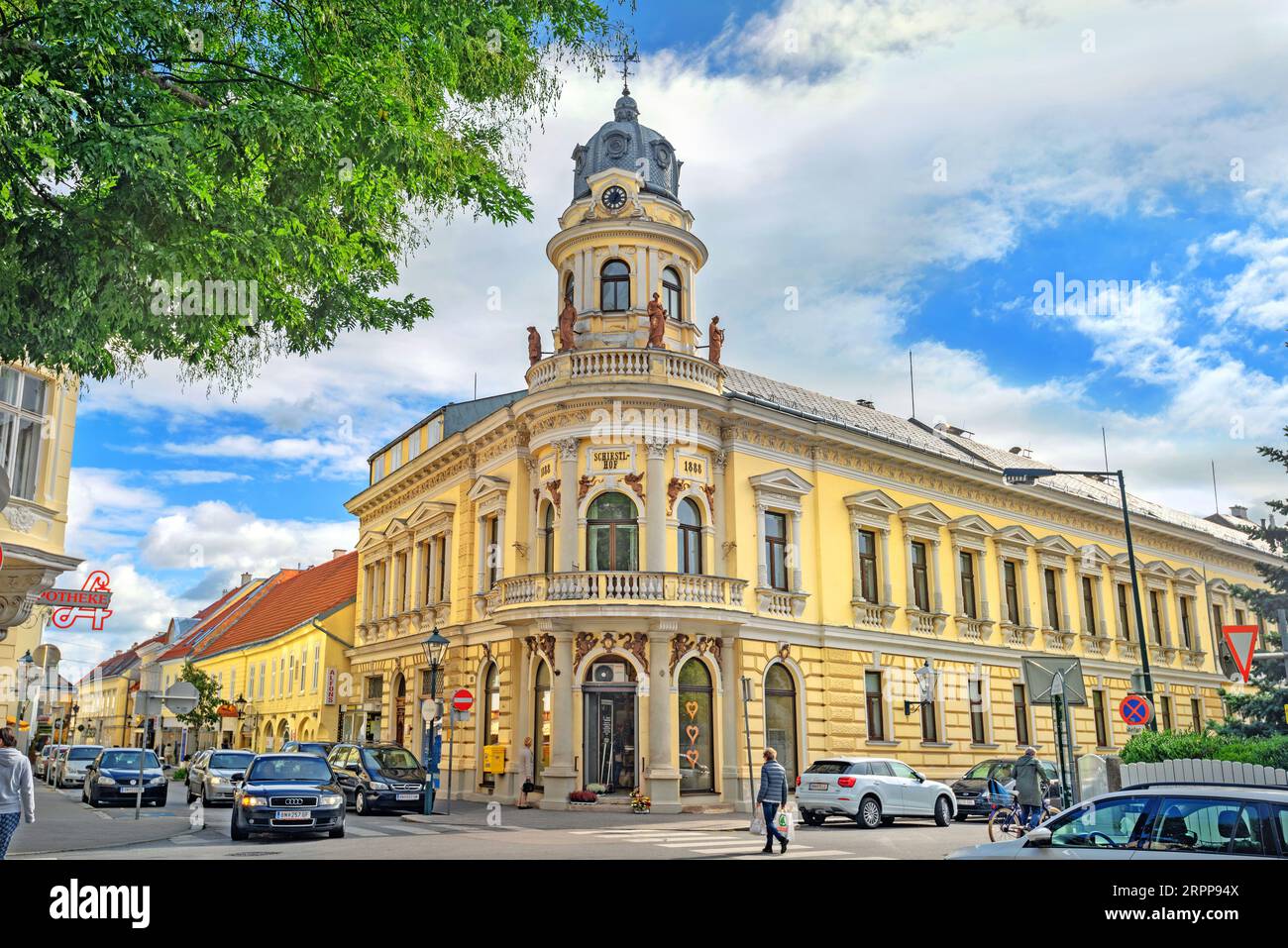 Cityscape with street and historical building with clock tower in centre of city. Baden bei Wien, Austria Stock Photo