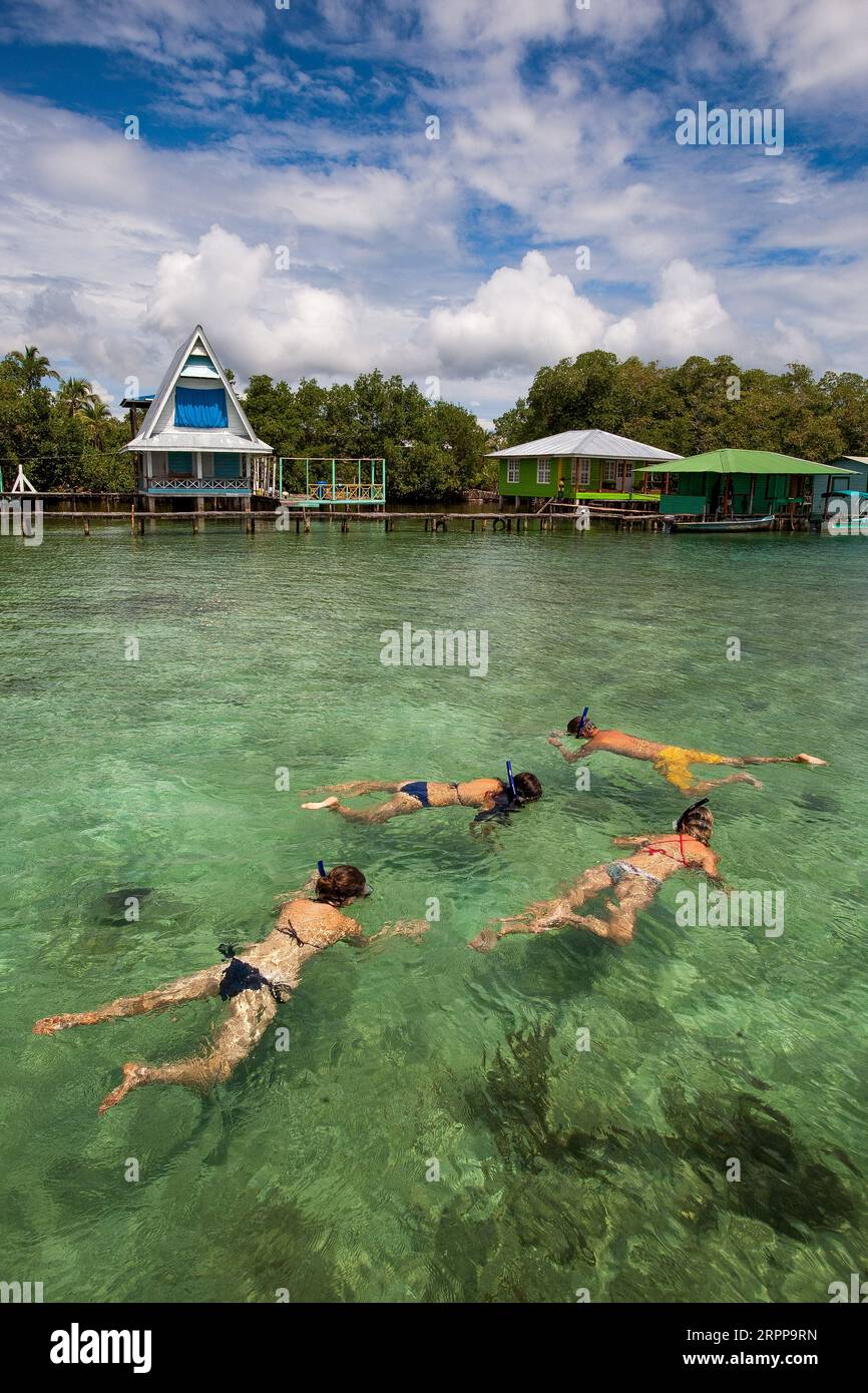 Panama, Archipielago de Bocas del Toro. Tourost snorckling at Cayo Coral of Isla Bastimentos. Stock Photo