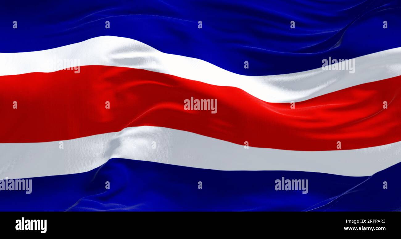 Costa Rica national civil flag waving in the wind. Blue, white, red, white, blue horizontal