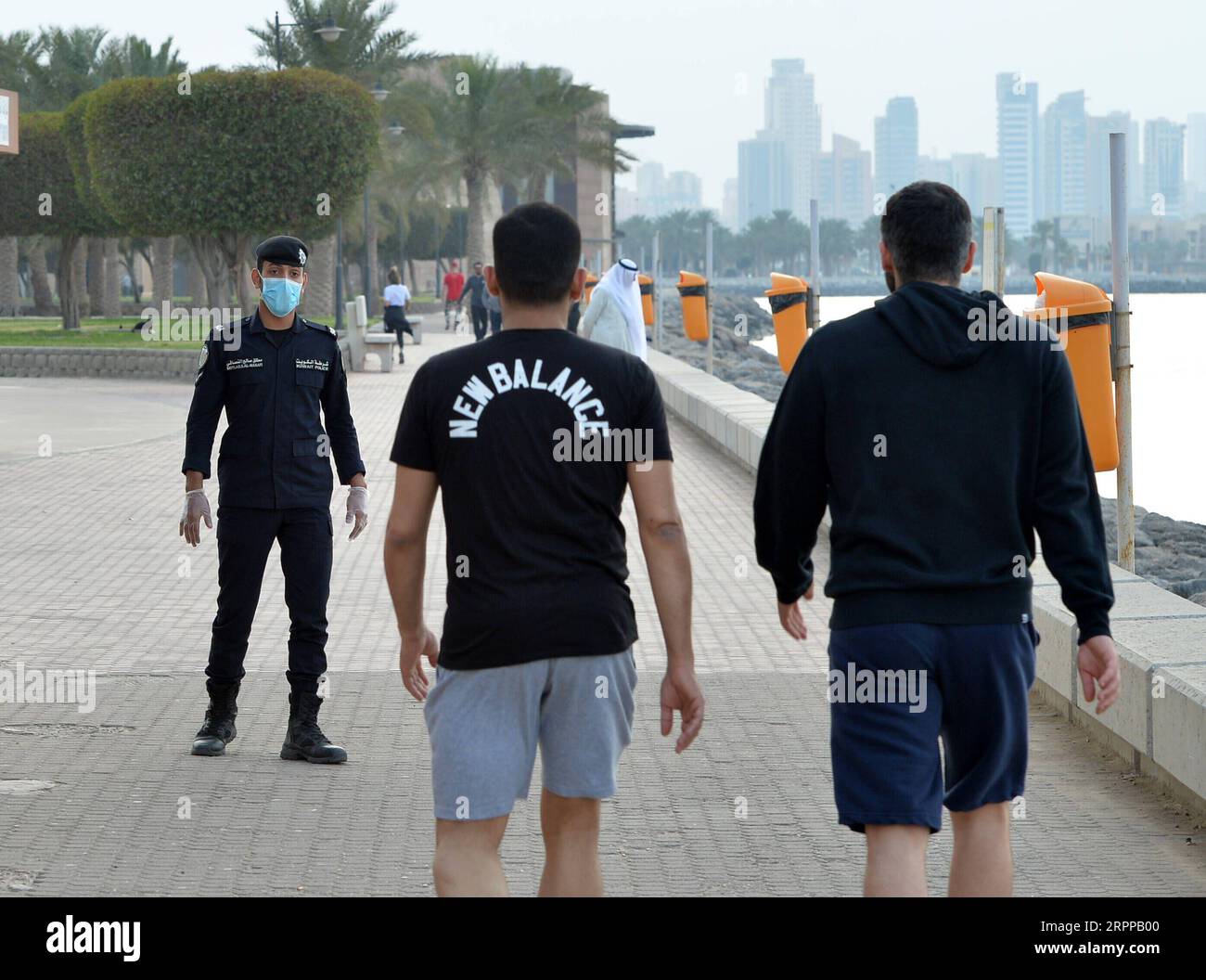 200314 -- KUWAIT CITY, March 14, 2020 -- A police officer wearing mask is on duty at a beach in Kuwait City, Kuwait, March 13, 2020. Kuwait reported four new COVID-19 cases on Saturday, bringing the total number of confirmed cases in the country to 104. Photo by Asad/Xinhua KUWAIT-KUWAIT CITY-CORONAVIRUS NiexYunpeng PUBLICATIONxNOTxINxCHN Stock Photo