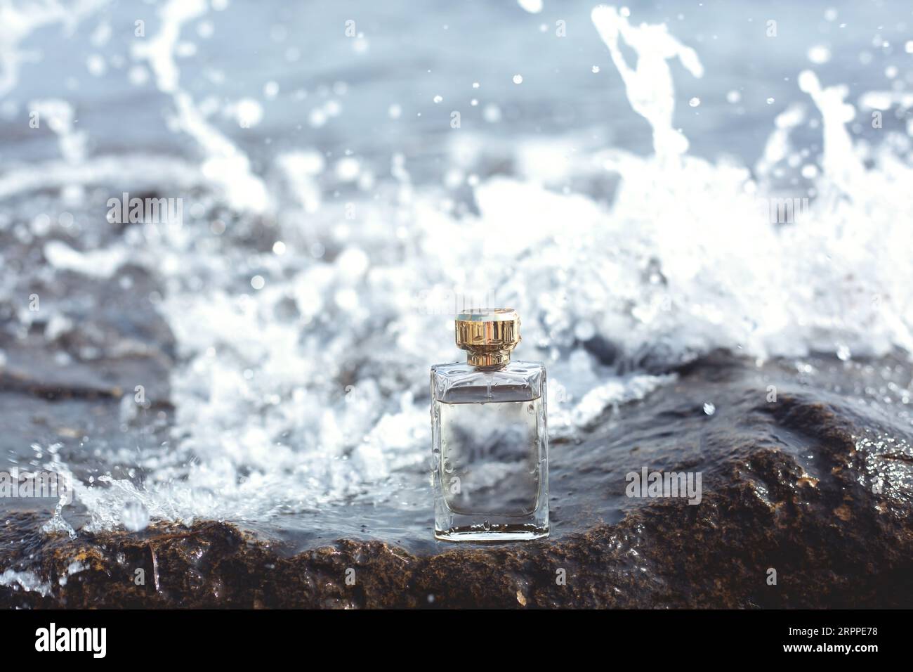 bottle of perfume on the background of the sea Stock Photo