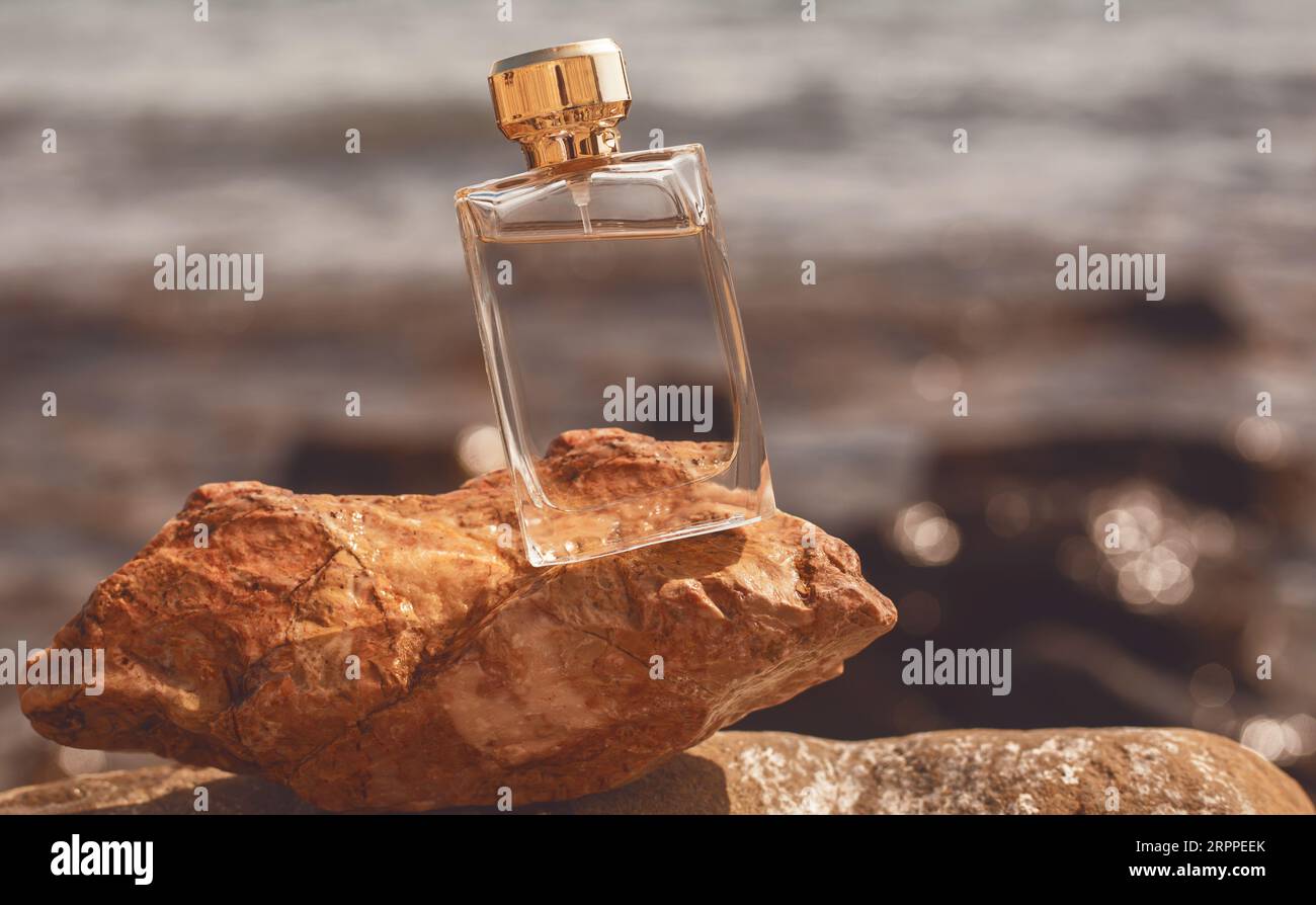 bottle of perfume on the background of the sea Stock Photo