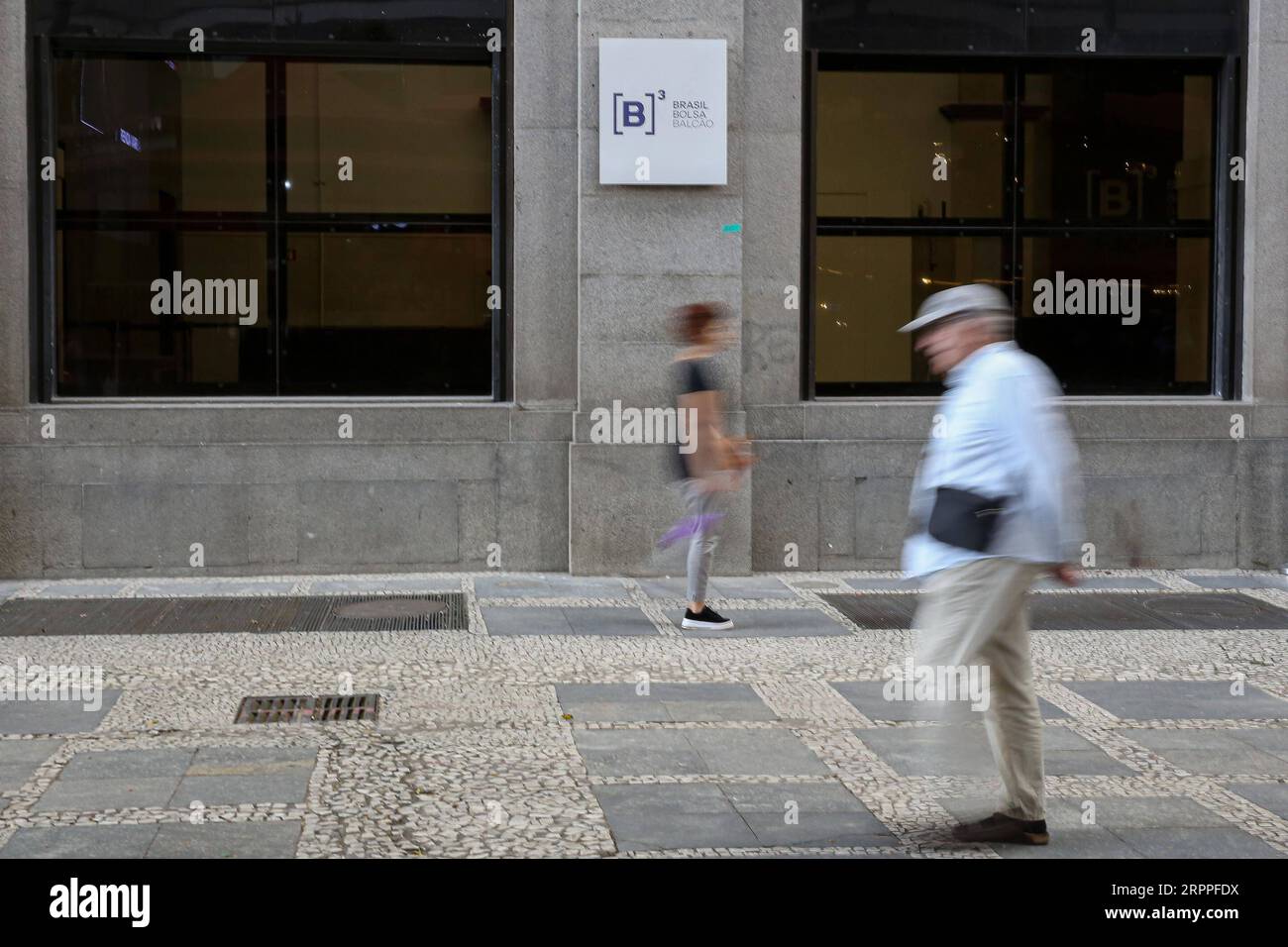 200317 -- SAO PAULO, March 17, 2020 -- People walk past the Stock