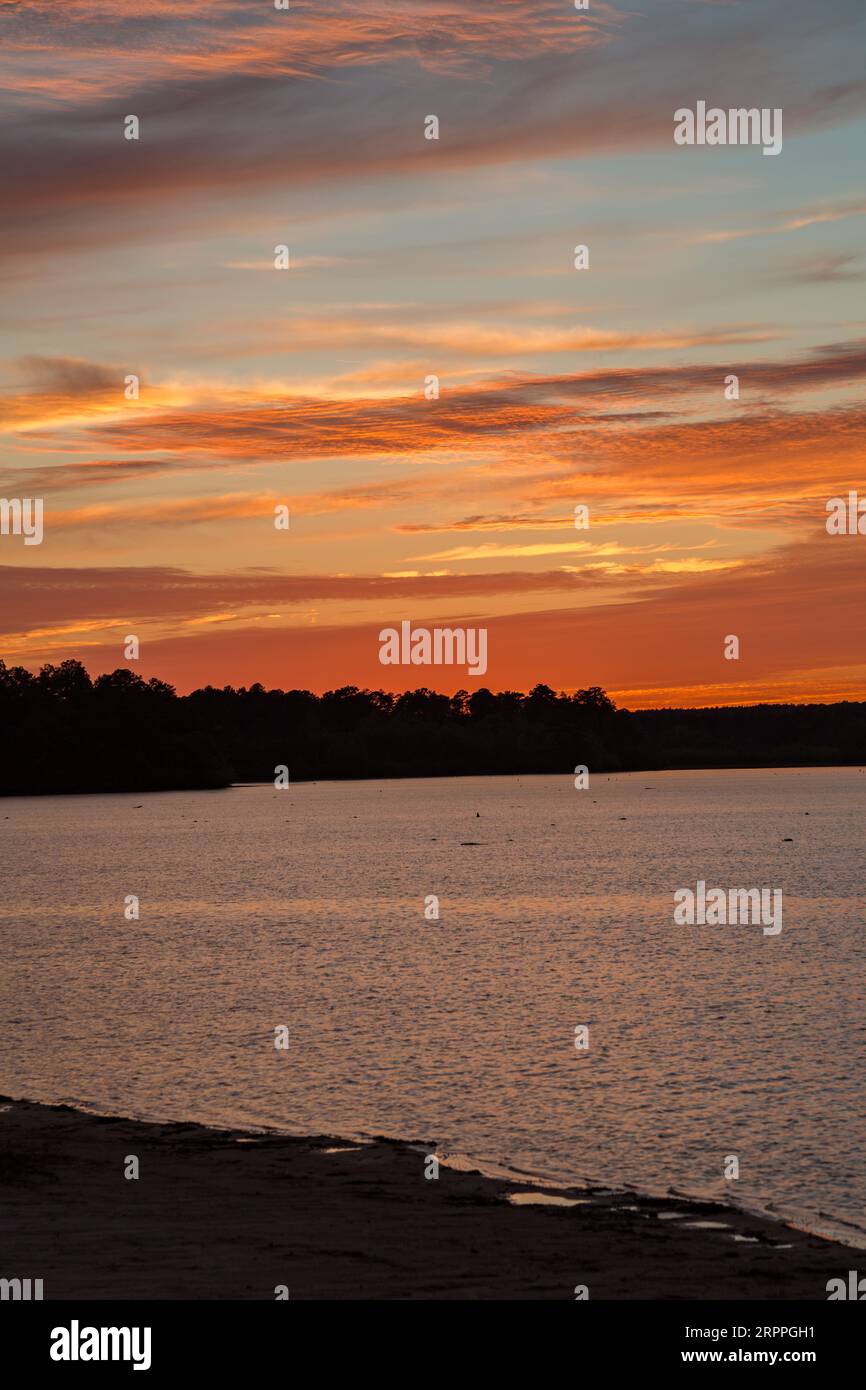 Sun setting over the lake at Little Black Creek campground near Lumberton, Mississippi Stock
