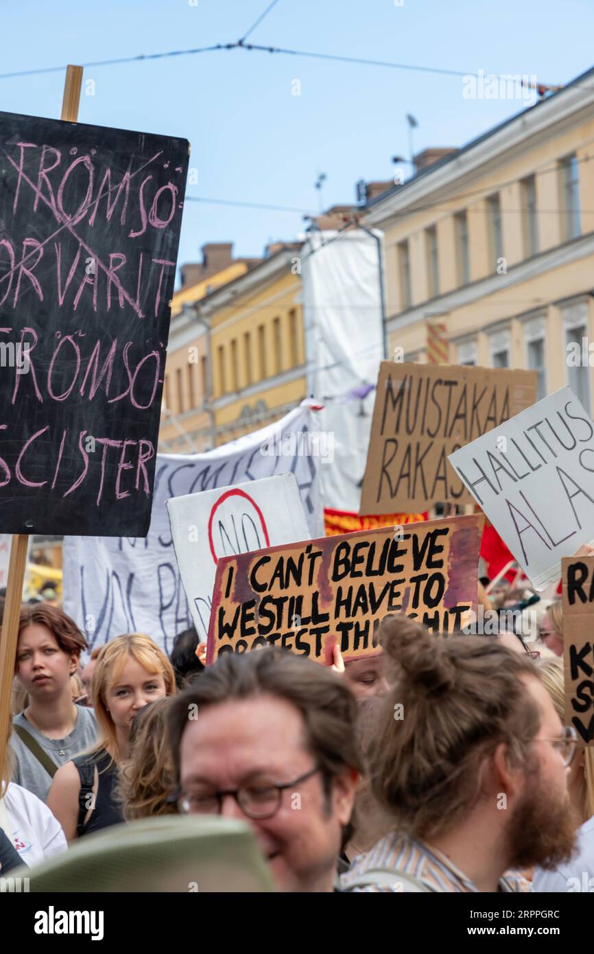 Protestors and signs in Senate Square during the ’End the silence!’ demonstration against racism and fascism in the Finnish government. Stock Photo
