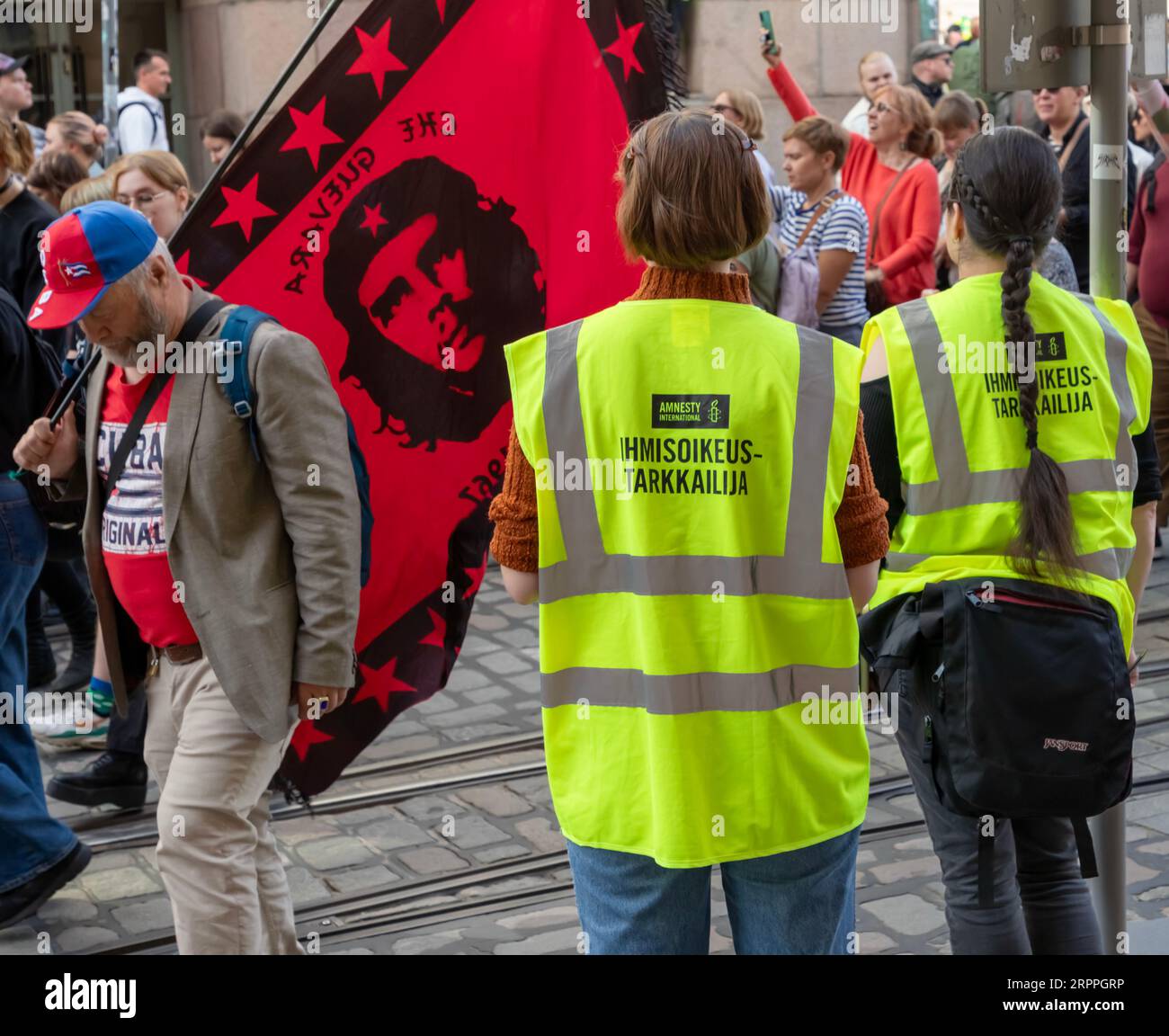 Amnesty International human rights observers overlooking the ’End the silence!’ demonstration against racism and fascism in the Finnish government. Stock Photo