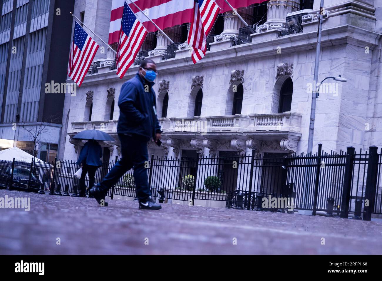 200318 -- NEW YORK, March 18, 2020 -- A pedestrian passes by the New York Stock Exchange NYSE in New York, the United States, March 17, 2020. The number of COVID-19 cases in the United States has topped 6,000 by 7 p.m. local time Tuesday 2300 GMT, according to the Center for Systems Science and Engineering at Johns Hopkins University. The fresh figure reached 6,233, increasing over 1,000 within about 7 hours. A total of 105 deaths have been reported across the country. Photo by /Xinhua U.S.-NEW YORK-COVID-19-CONFIRMED CASES MichaelxNagle PUBLICATIONxNOTxINxCHN Stock Photo