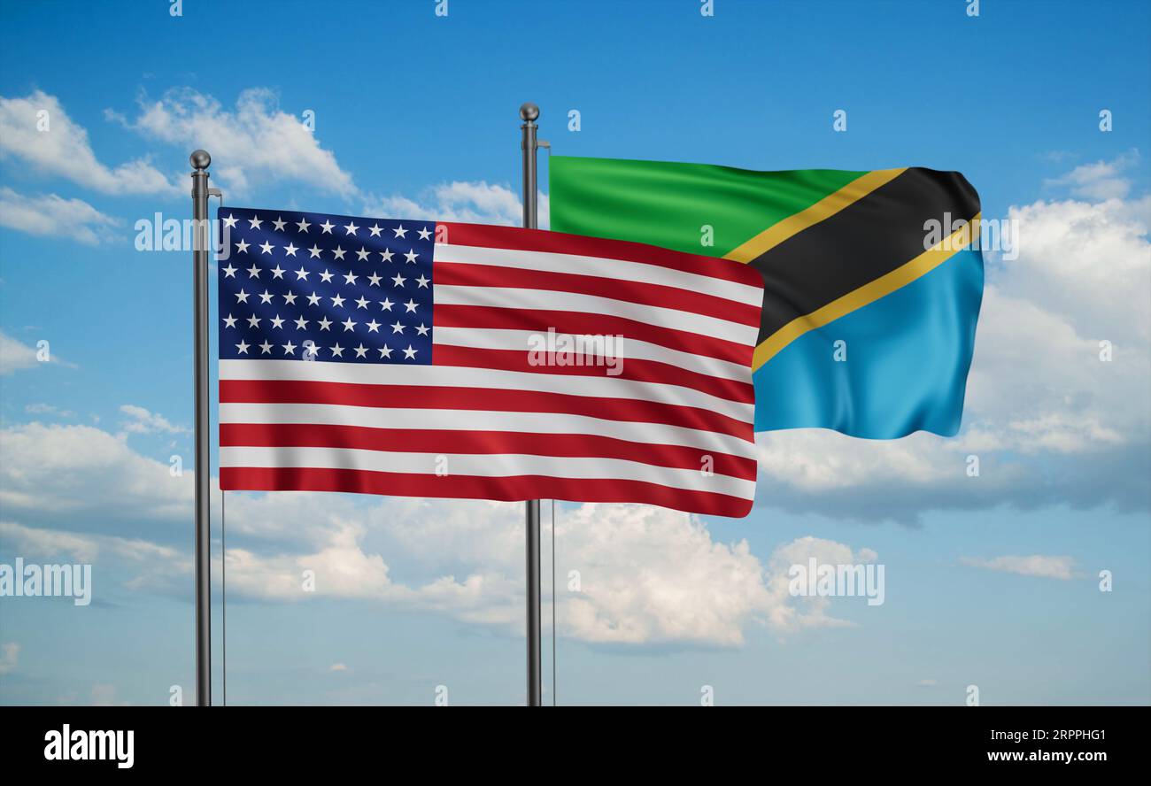 Tanzania and USA flag waving together in the wind on blue sky, two ...