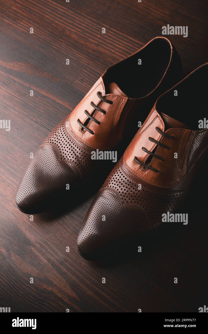 Men shoes on brown wooden background Stock Photo