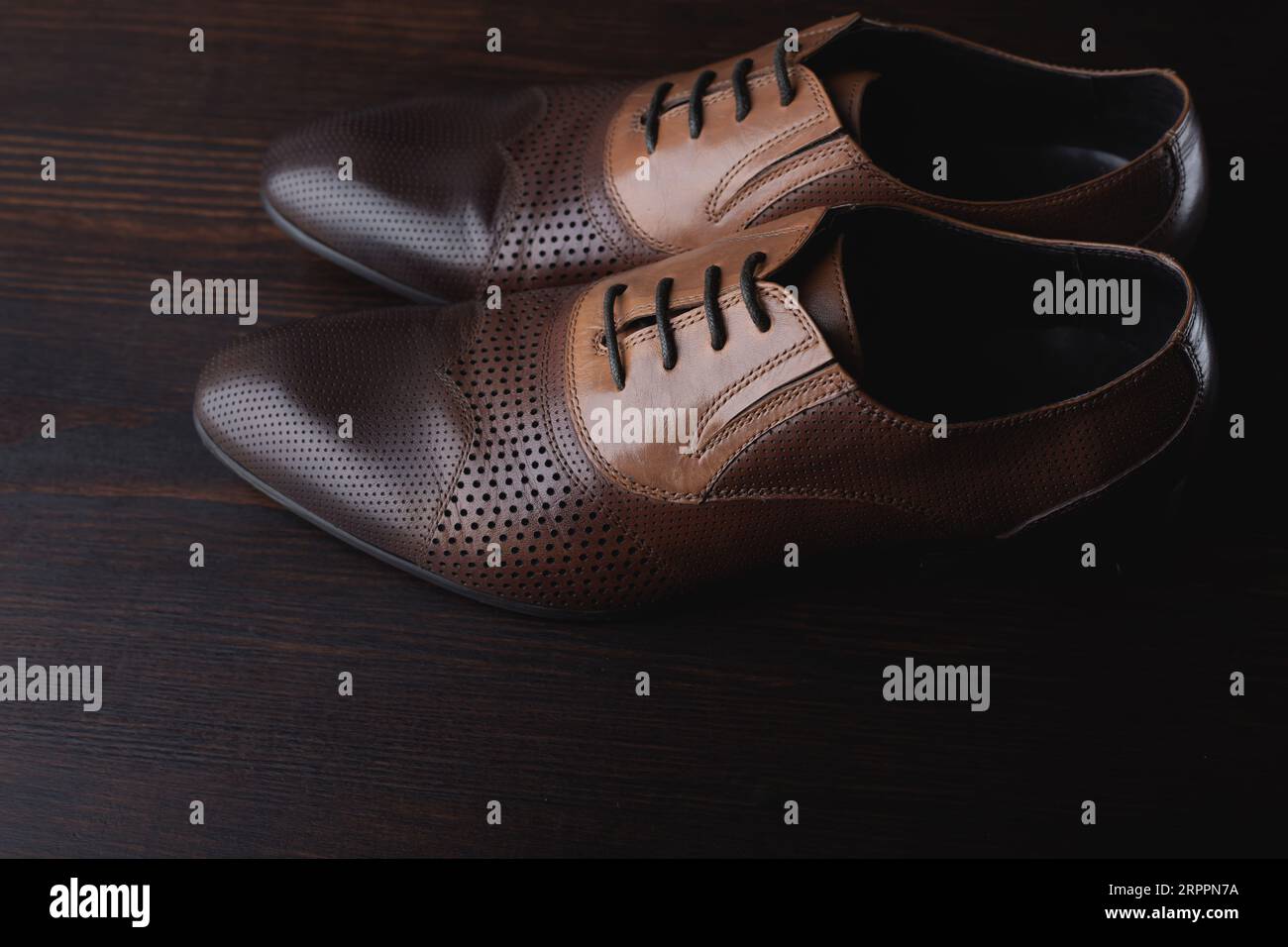 Men shoes on brown wooden background Stock Photo