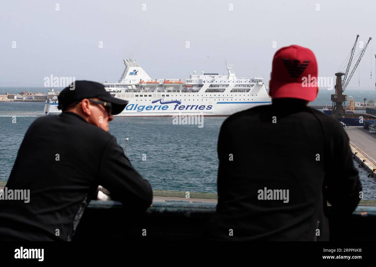 200320 -- ALGIERS, March 20, 2020 Xinhua -- A ship carrying Algerians from France arrives in Algiers, Algeria, on March 19, 2020. Algerian government said the passengers will be sent to several hotels for medical examinations and then all will be quarantined for 14 days before returning to their hometowns. Xinhua ALGERIA-COVID-19-RETURNING FROM EUROPE PUBLICATIONxNOTxINxCHN Stock Photo