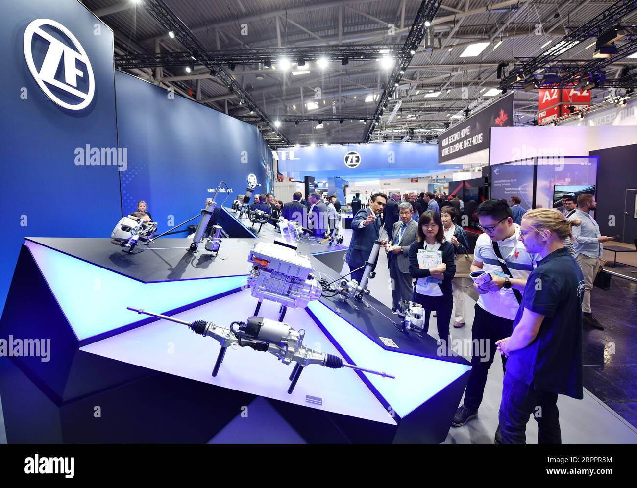 (230905) -- MUNICH, Sept. 5, 2023 (Xinhua) -- People visit the booth of ZF during the 2023 International Motor Show, officially known as the IAA MOBILITY 2023, in Munich, Germany, Sept. 5, 2023. The IAA MOBILITY 2023, one of the world's largest mobility trade fairs, opened in the southern German city of Munich on Tuesday. At the six-day event are some 70 Chinese firms, the second largest number after the German participants. Under the motto of 'Experience Connected Mobility' of this year's IAA, Chinese carmakers are rolling out more chances and choices for local partners and customers in E Stock Photo
