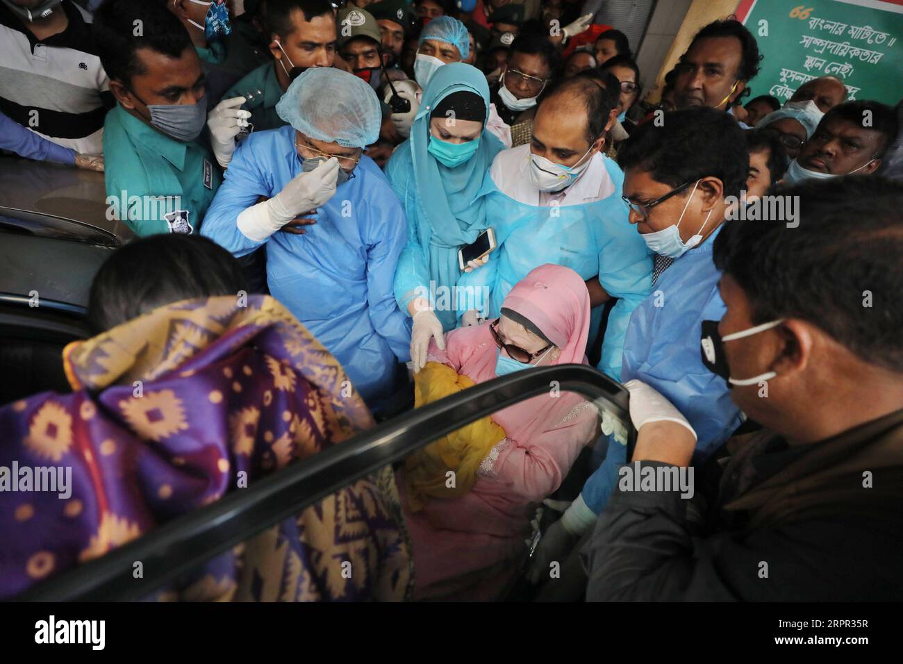 200325 -- DHAKA, March 25, 2020 Xinhua -- Bangladeshi ex-Prime Minister Khaleda Zia in pink clothes leaves the Bangabandhu Sheikh Mujib Medical University BSMMU in Dhaka, Bangladesh, March 25, 2020. Khaleda Zia has been released from jail for six months on humanitarian grounds in light of the COVID-19 outbreak in the country. Zia, also chairperson of Bangladesh Nationalist Party BNP, at around 4:15 p.m. local time on Wednesday, came out of Bangabandhu Sheikh Mujib Medical University BSMMU in capital Dhaka, where she was being treated. In April 2018, Zia was shifted to the BSMMU when she fell i Stock Photo