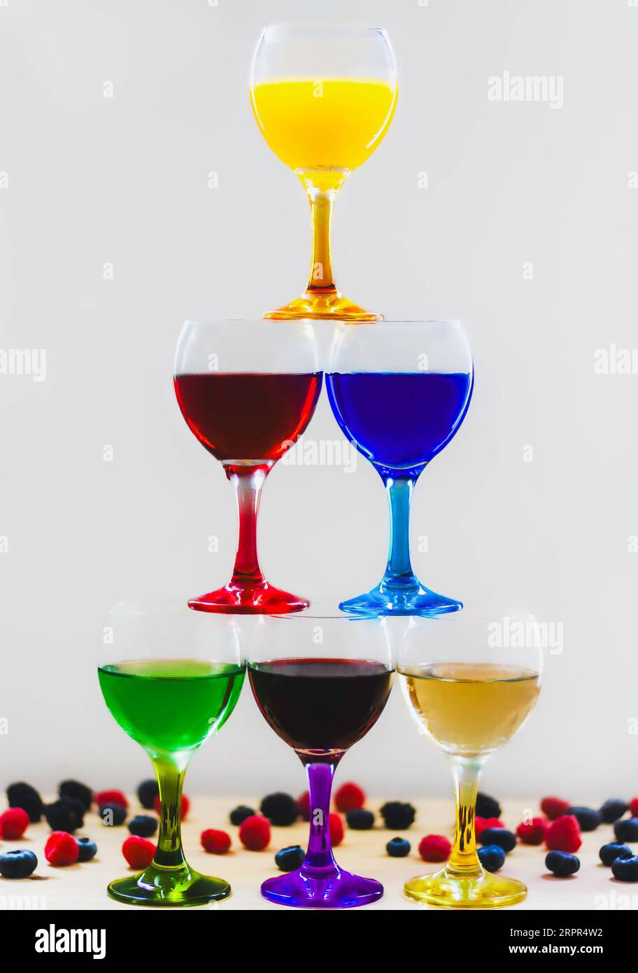 A stack of colourful, fruity drinks with assorted berries Stock Photo