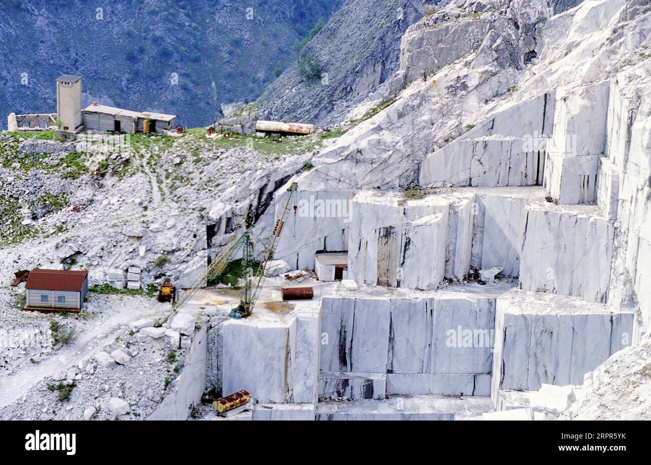 High stone mountain and marble quarries in the Apennines in Tuscany, Carrara Italy. Open marble mining. Stock Photo
