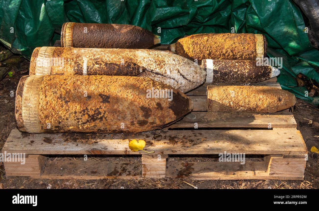 Unexploded First World War shells stacked for collection from French farm in the Somme region Stock Photo