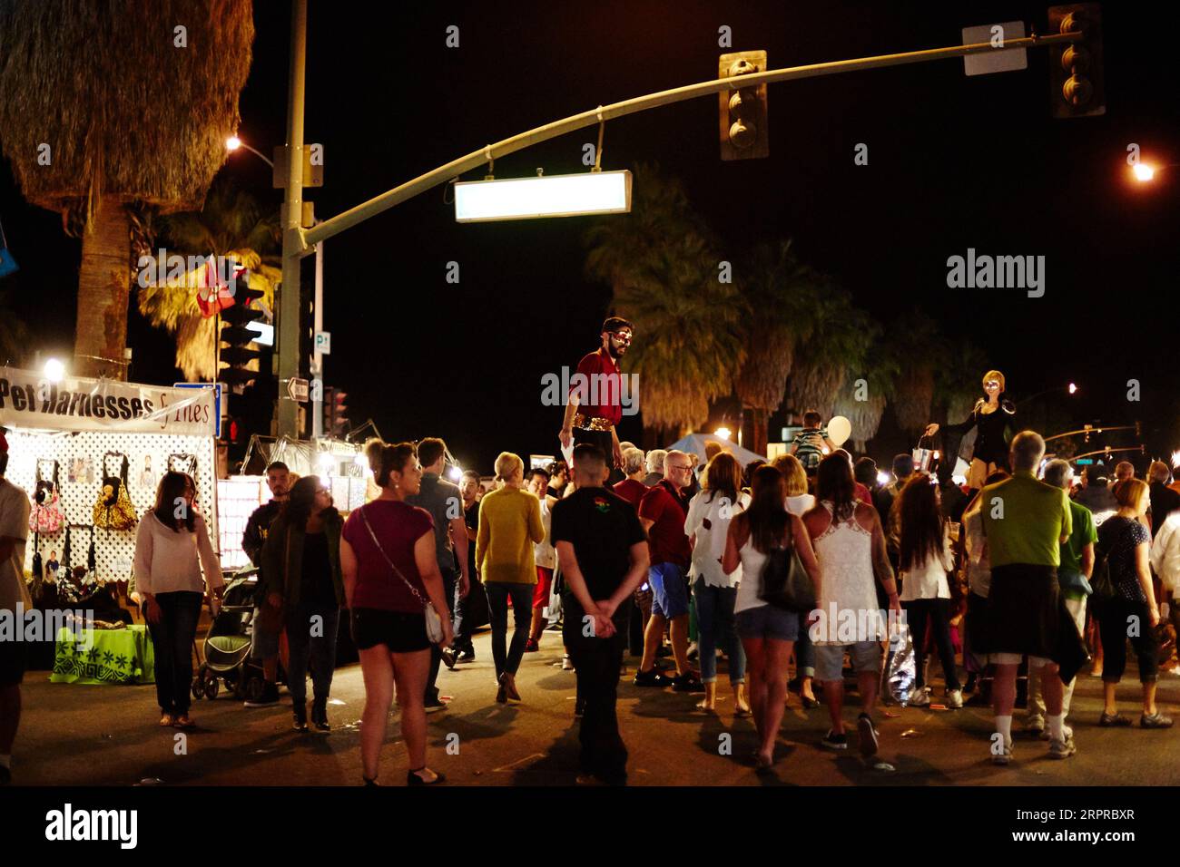 Palm Springs, California, USA. 30th Oct, 2014. A crowd watching stilt walkers at the Thursday night Street Fair on Palm Canyon Drive in Palm Springs. (Credit Image: © Ian L. Sitren/ZUMA Press Wire) EDITORIAL USAGE ONLY! Not for Commercial USAGE! Stock Photo