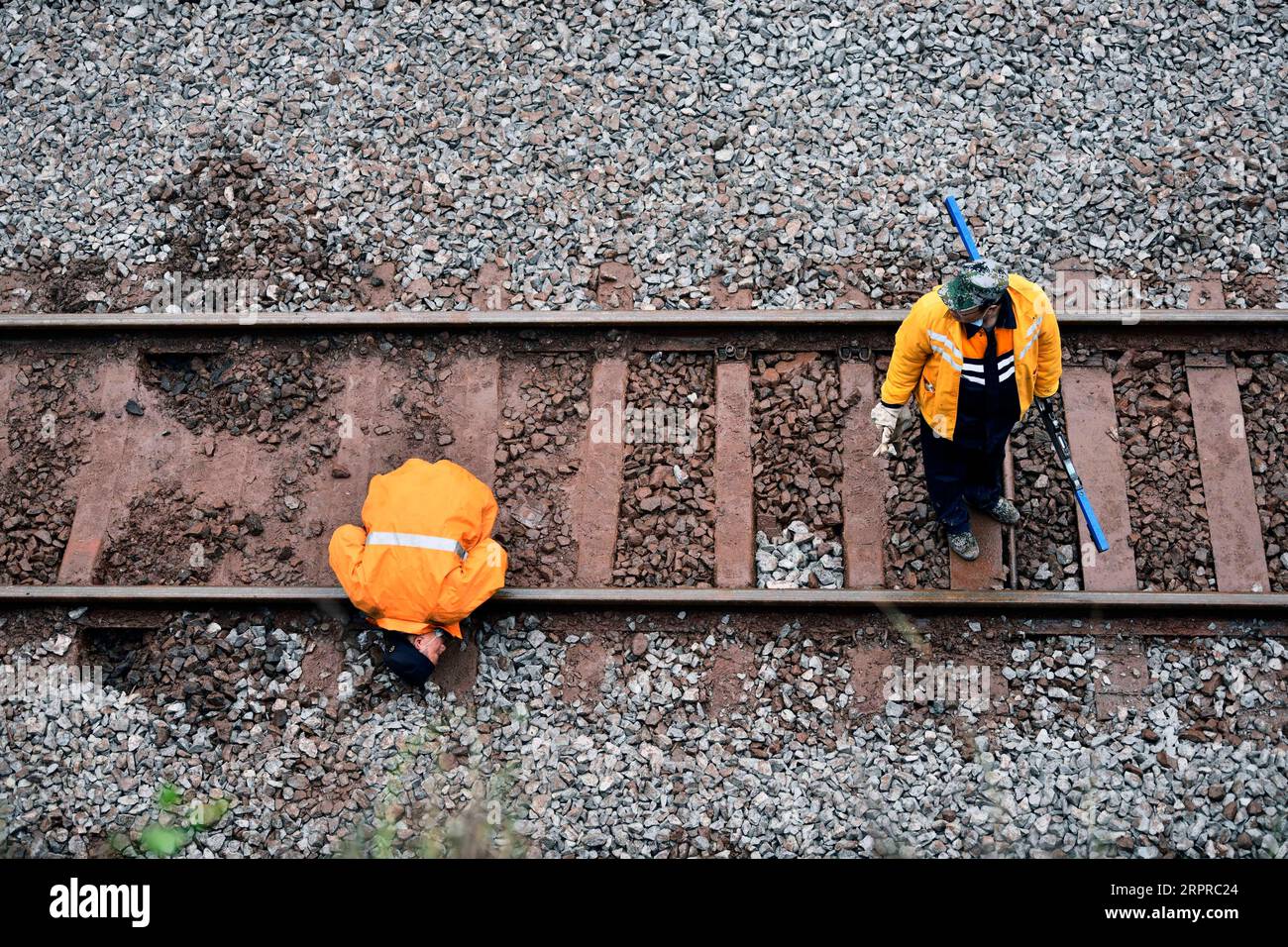 200331 -- YONGXING, March 31, 2020 -- Workers check the railway tracks at the site of a train derailment in Yongxing County of Chenzhou City, central China s Hunan Province, March 31, 2020. Railway repair is well underway after a train derailed in Chenzhou Monday that killed one and injured 127.  CHINA-HUNAN-CHENZHOU-TRAIN DERAILMENT-REPAIR CN LixGa PUBLICATIONxNOTxINxCHN Stock Photo