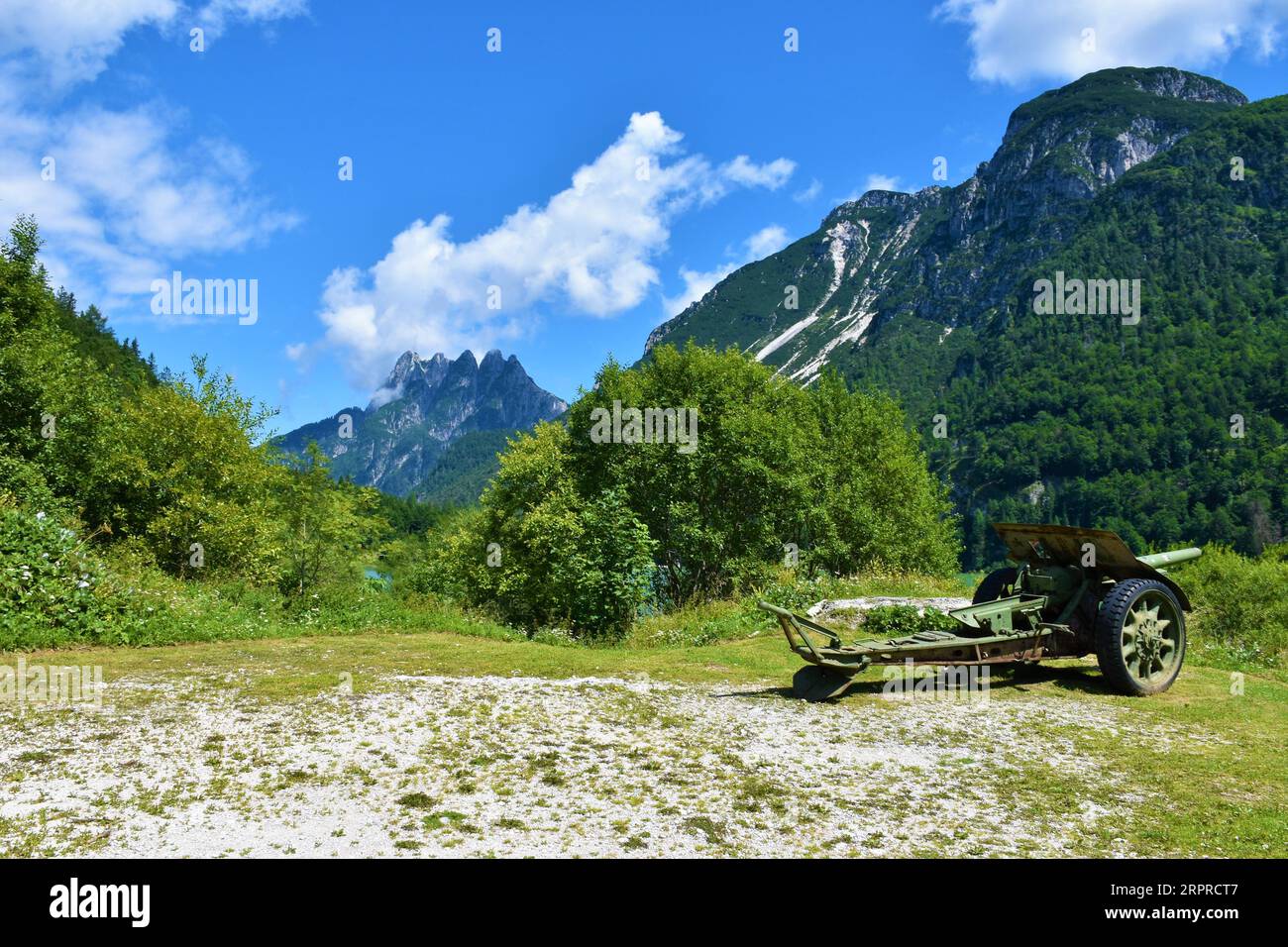WW1 artillery at Lago del Predil and Cinque Punte mountain in the background near Tarvisio, Italy Stock Photo