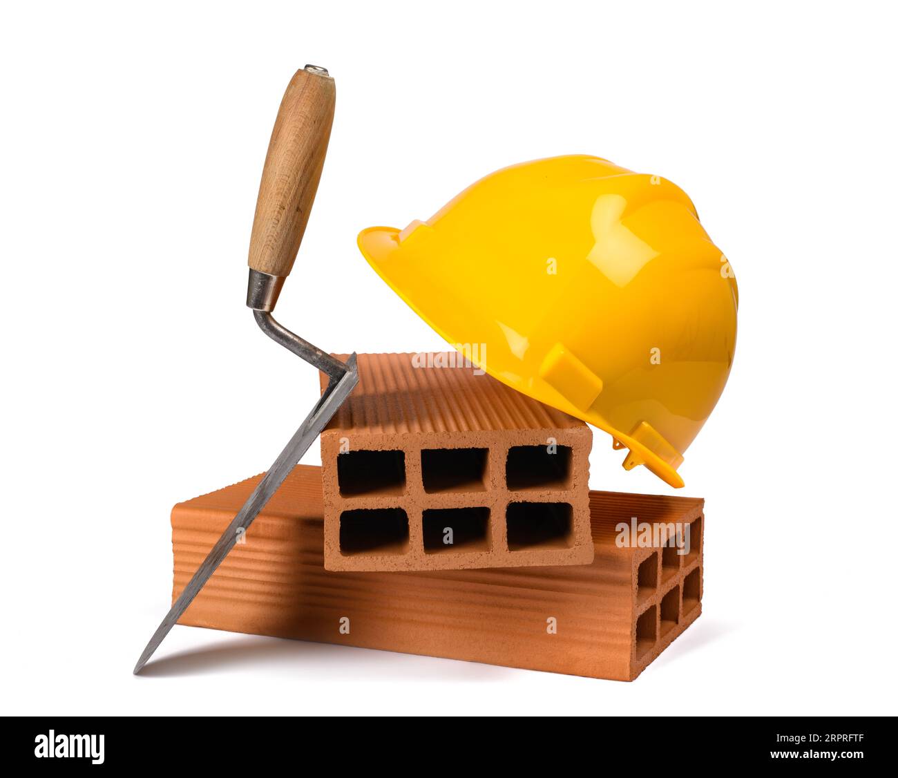 Trowel  bricks and hardhat isolated on white background Stock Photo