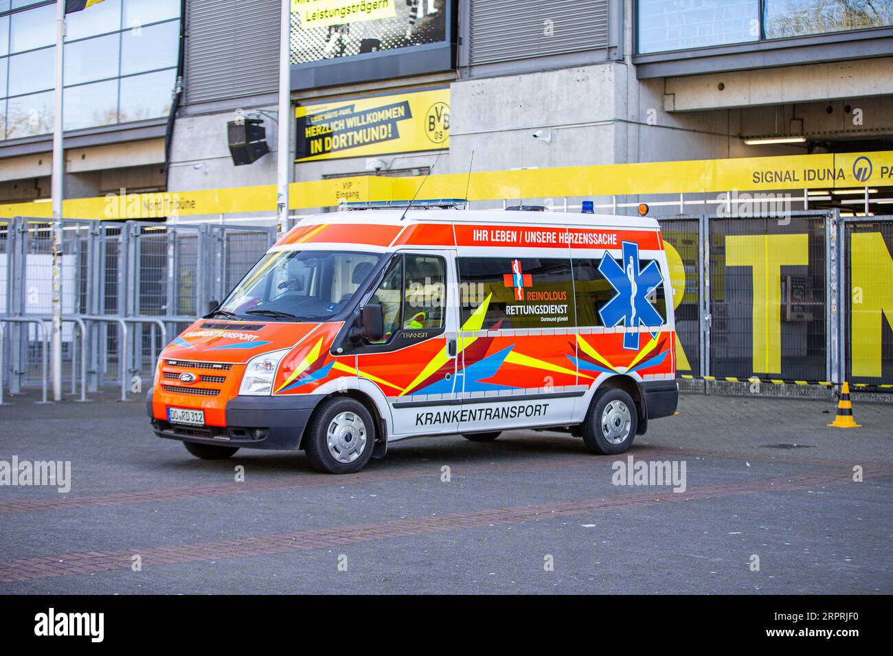 200405 -- DORTMUND, April 5, 2020 Xinhua -- An ambulance is seen outside the COVID-19 testing center at Borussia Dortmund s stadium in Dortmund, Germany, April 4, 2020. Borussia Dortmund s stadium housed a COVID-19 testing center From Saturday. Rooms in the Westfalenstadion s north stand have been prepared to take in people suspected of suffering from COVID-19. It is hoped the center will relieve pressure on the medical facilities in the city of Dortmund. Photo by Joachim Bywaletz/Xinhua SPGERMANY-DORTMUND-STADIUM-COVID-19-TESTING CENTER PUBLICATIONxNOTxINxCHN Stock Photo