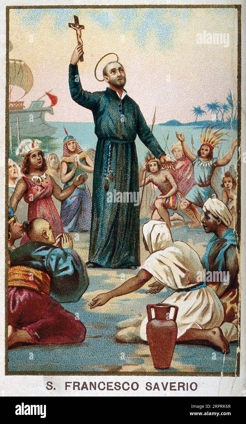 Saint Francis Xavier, 1506 - 1552, holding a crucifix surrounded by Asian and African people kneeling in front of him, sea and a ship in the background. Colour lithograph c1898. Stock Photo
