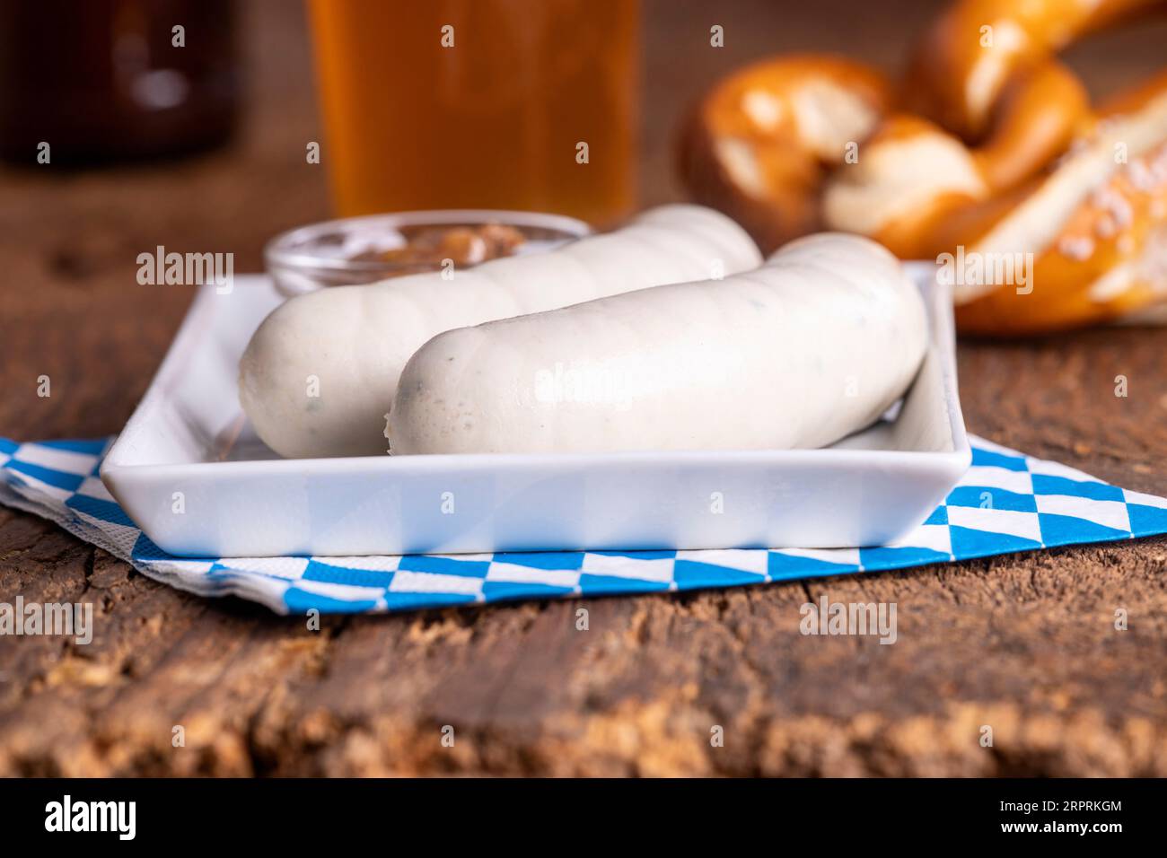 two bavarian white sausages on wood Stock Photo