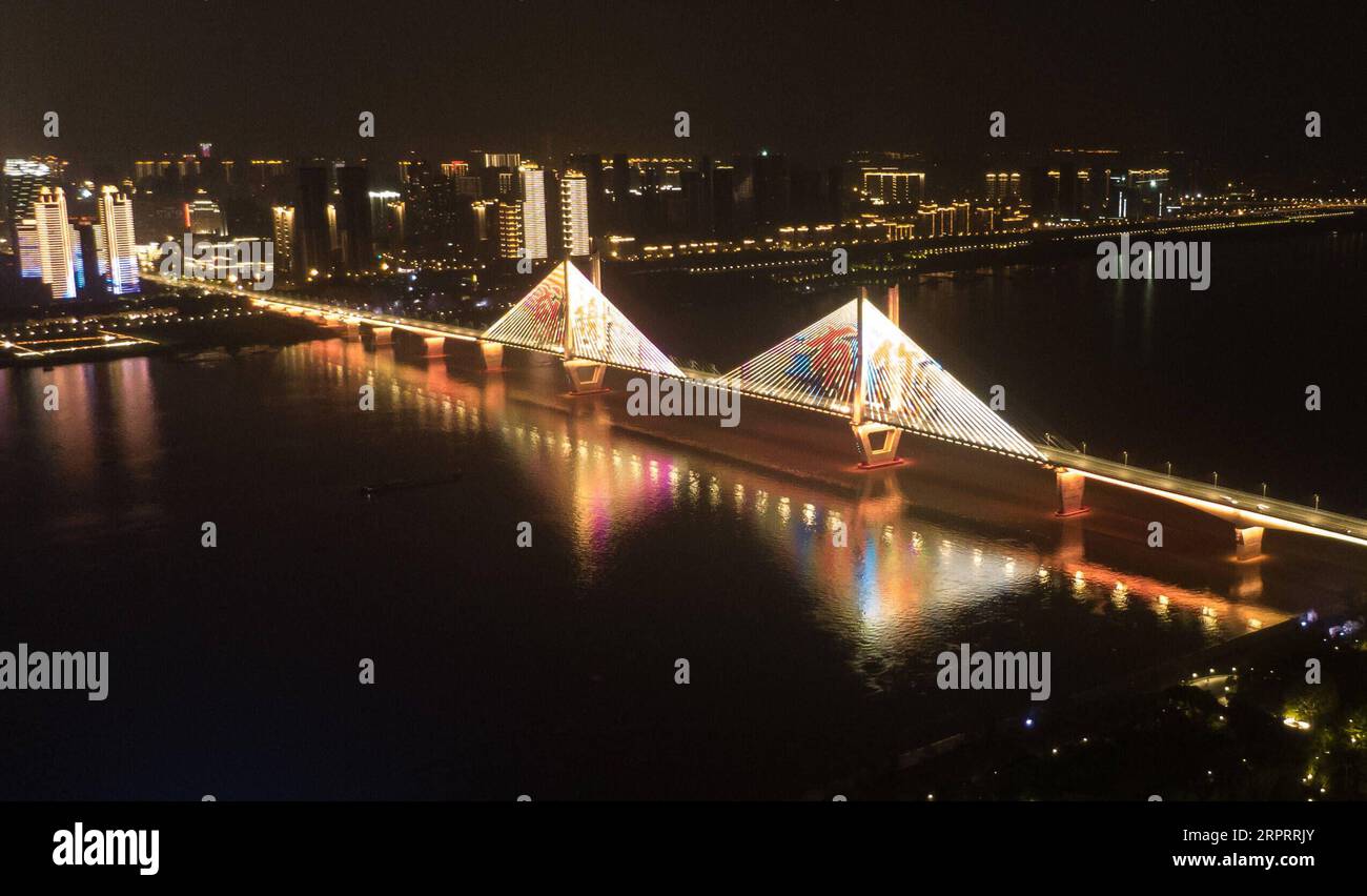 200408 -- WUHAN, April 8, 2020 -- Aerial photo taken on April 8, 2020 shows an illuminated bridge in Wuhan, central China s Hubei Province. Wuhan, the megacity in central China, started lifting outbound travel restrictions from Wednesday after almost 11 weeks of lockdown to stem the spread of COVID-19.  CHINA-HUBEI-WUHAN-OUTBOUND TRAVEL RESTRICTIONS-LIFT CN ChengxMin PUBLICATIONxNOTxINxCHN Stock Photo