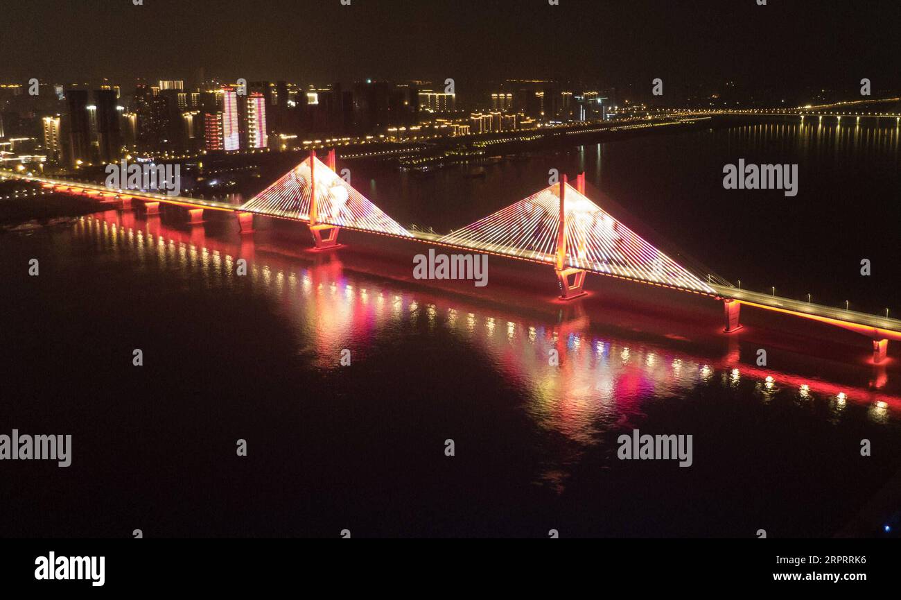 200408 -- WUHAN, April 8, 2020 -- Aerial photo taken on April 8, 2020 shows an illuminated bridge in Wuhan, central China s Hubei Province. Wuhan, the megacity in central China, started lifting outbound travel restrictions from Wednesday after almost 11 weeks of lockdown to stem the spread of COVID-19.  CHINA-HUBEI-WUHAN-OUTBOUND TRAVEL RESTRICTIONS-LIFT CN ChengxMin PUBLICATIONxNOTxINxCHN Stock Photo