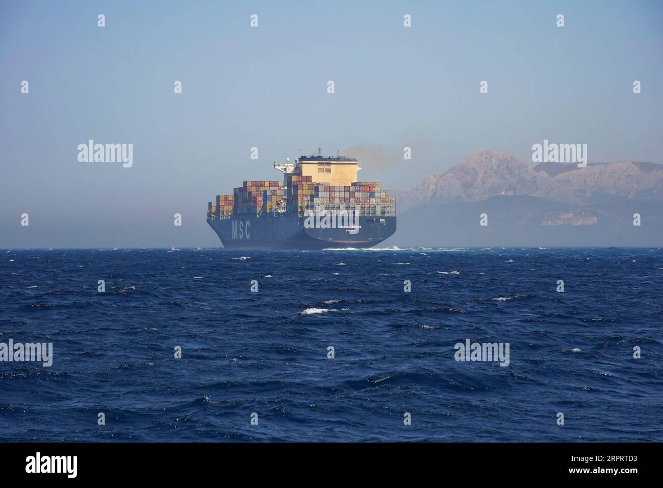 Container ship at open sea, atlantic ocean, crossing the Strait of Gibraltar, Andalusia, Spain Stock Photo