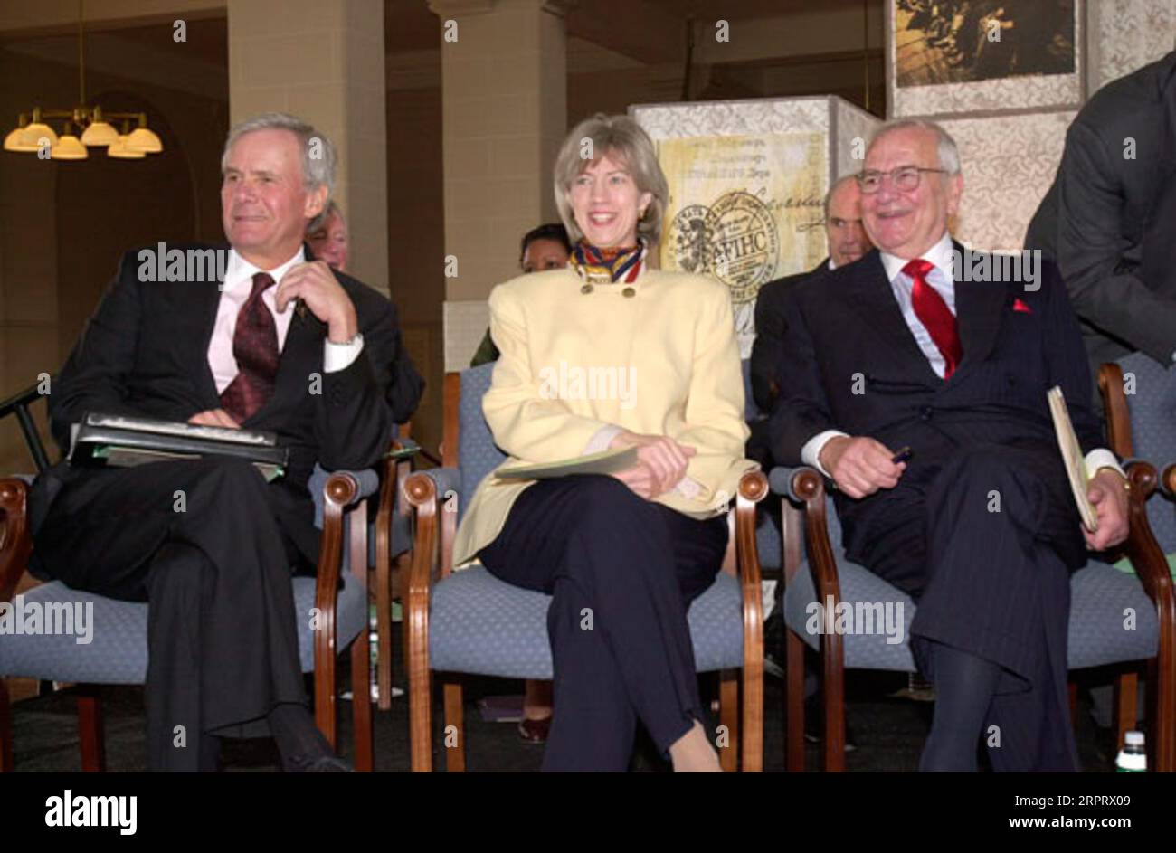 Television news anchor Tom Brokaw, Secretary Gale Norton, and Chairman of the Statue of Liberty-Ellis Island Foundation, auto executive Lee Iacocca, left to right, at opening of the American Family Immigration History Center at the Ellis Island Immigration Museum, New York City, New York Stock Photo