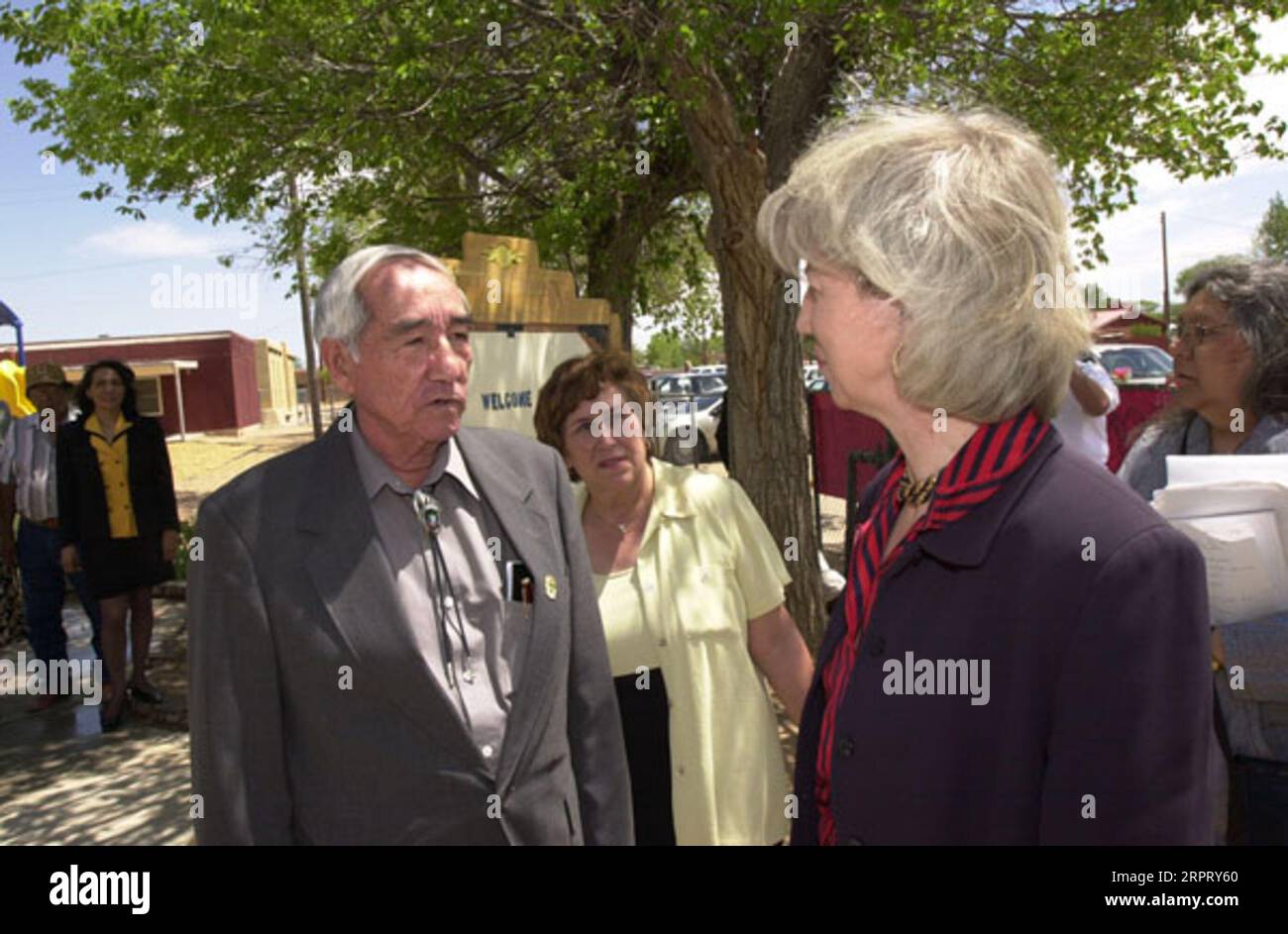 Secretary Gale Norton, far right, outside school building during visit