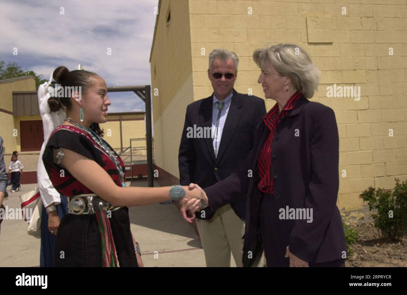 Secretary Gale Norton, far right, shaking hands during visit to To Hajiilee-He Community School, an Eastern Navajo Agency-operated school in Canoncito, New Mexico. Visit highlighted federal support for American Indian schools, and such initiatives as the Family and Child Education Program emphasizing parent-child learning Stock Photo