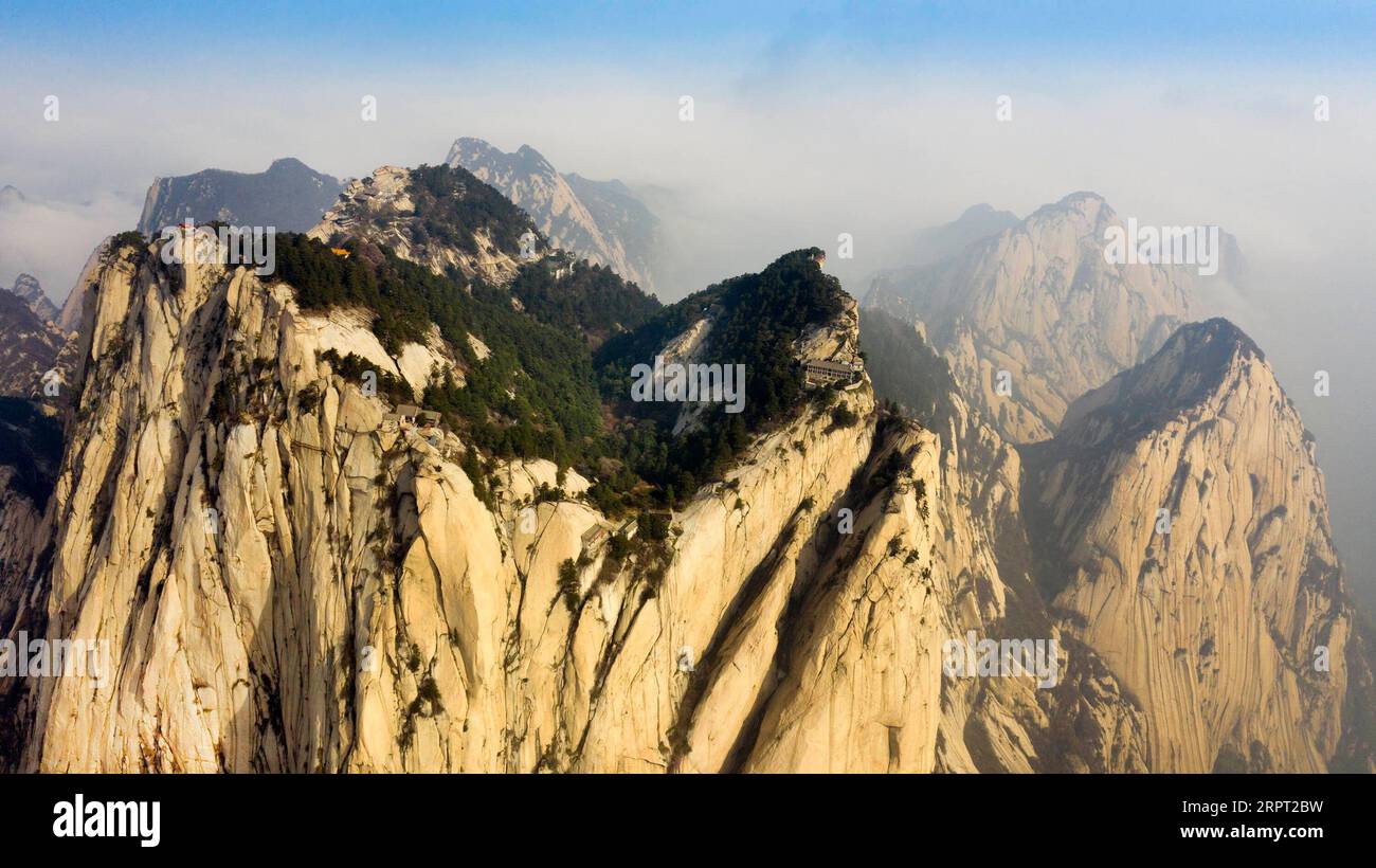 200410 -- HUASHAN, April 10, 2020 -- Aerial photo taken on April 10, 2020 shows a view of Mount Huashan in Huayin, northwest China s Shaanxi Province. Mount Huashan will resume opening from April 11, with a daily limit of 6,000 visitors.  SHAANXI-HUAYIN-MOUNT HUASHAN CN TaoxMing PUBLICATIONxNOTxINxCHN Stock Photo