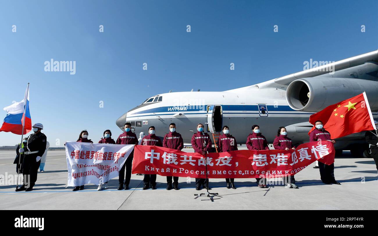 200411 -- HARBIN, April 11, 2020 -- Chinese medical experts pose for a  photo before boarding a plane at an airport in Harbin, northeast China s  Heilongjiang Province, April 11, 2020. A