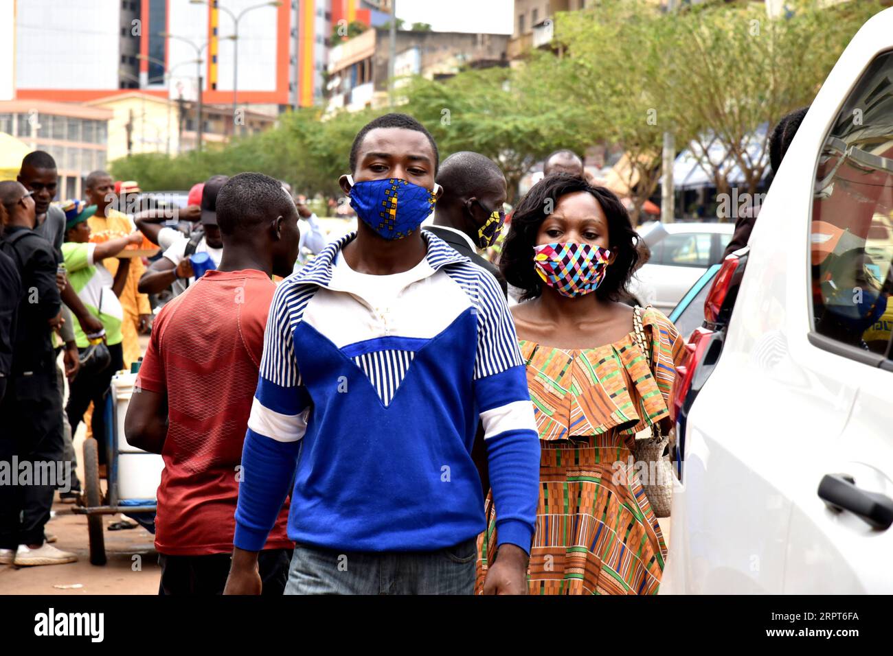 200412 -- YAOUNDE, April 12, 2020 Xinhua -- People wear cloth face masks to protect themselves against the COVID-19 in Yaounde, Cameroon on April 9, 2020. Recently, the wearing of a protective mask has become mandatory for all Cameroonians wishing to approach certain hospitals and public services, like the General Hospital of Yaounde, and government bodies in the country s southwest region. Photo by Jean Pierre Kepseu/Xinhua CAMEROON-YAOUNDE-COVID-19-FACE MASKS PUBLICATIONxNOTxINxCHN Stock Photo