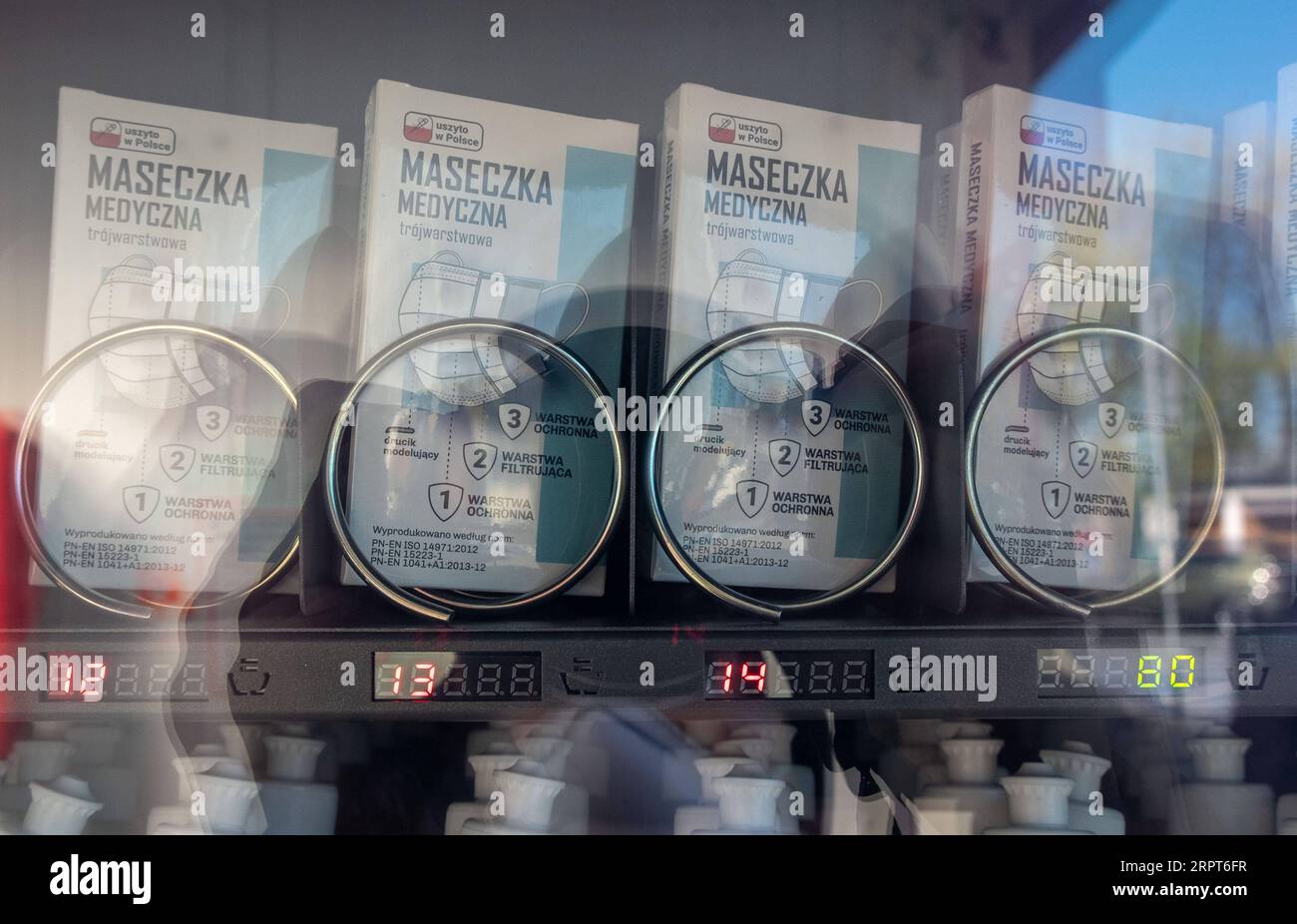 200412 -- BEIJING, April 12, 2020 -- Protective face masks are displayed inside a vending machine selling face masks, gloves and sanitizers in Warsaw, Poland, April 11, 2020.  XINHUA PHOTOS OF THE DAY ZhouxNan PUBLICATIONxNOTxINxCHN Stock Photo