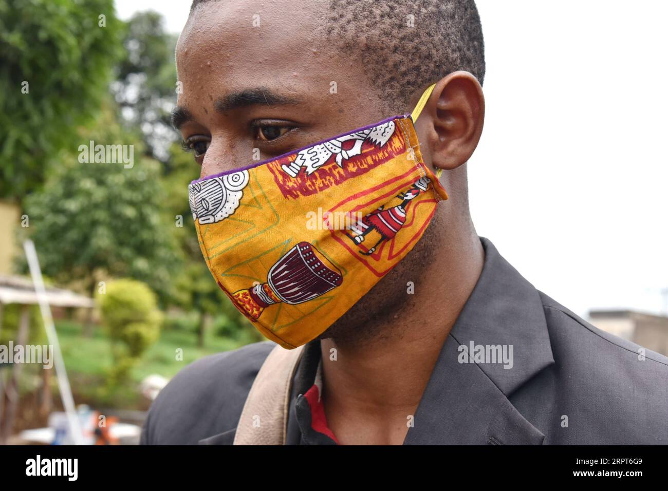 200412 -- YAOUNDE, April 12, 2020 Xinhua -- A man wears a cloth face mask to protect himself against the COVID-19 in Yaounde, Cameroon on April 9, 2020. Recently, the wearing of a protective mask has become mandatory for all Cameroonians wishing to approach certain hospitals and public services, like the General Hospital of Yaounde, and government bodies in the country s southwest region. Photo by Jean Pierre Kepseu/Xinhua CAMEROON-YAOUNDE-COVID-19-FACE MASKS PUBLICATIONxNOTxINxCHN Stock Photo
