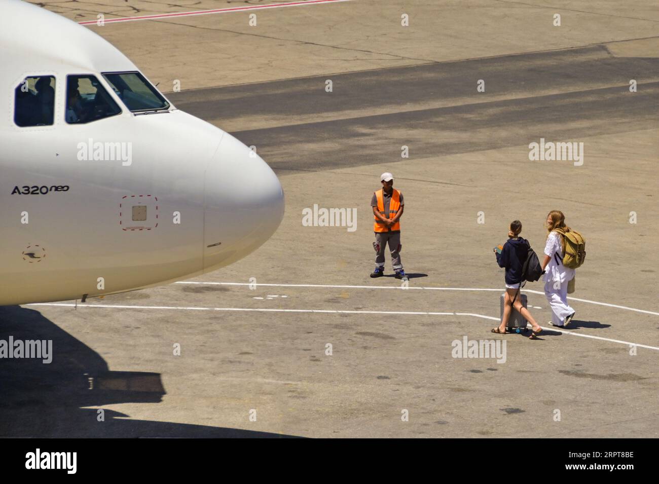 Luqa, Malta - 7 August 2023: Passengers Walking Out To Board An Air ...