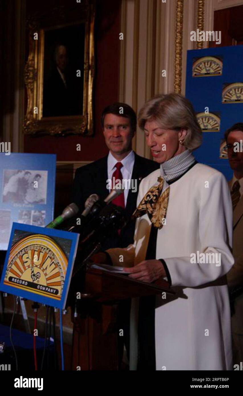 Secretary Gale Norton speaking, and Tennessee Senator Bill Frist behind, at Capitol Hill, Washington, D.C. event designating Sun Records, Memphis Recording Service, the pioneering rock music studio founded by the late Sam Phillips, as a National Historic Landmark Stock Photo