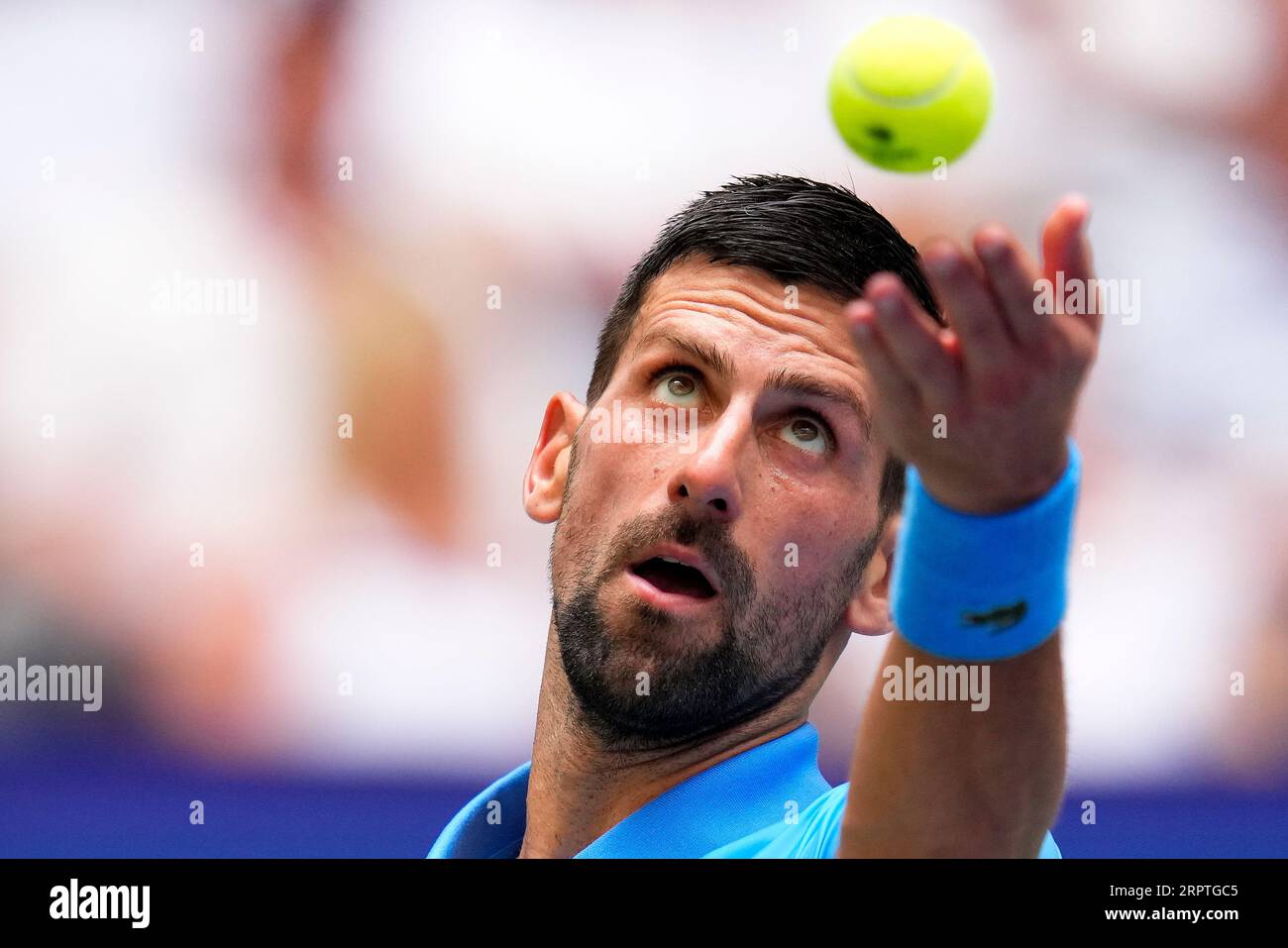 Novak Djokovic, of Serbia, serves to Taylor Fritz, of the United States, during the quarterfinals of the U.S. Open tennis championships, Tuesday, Sept