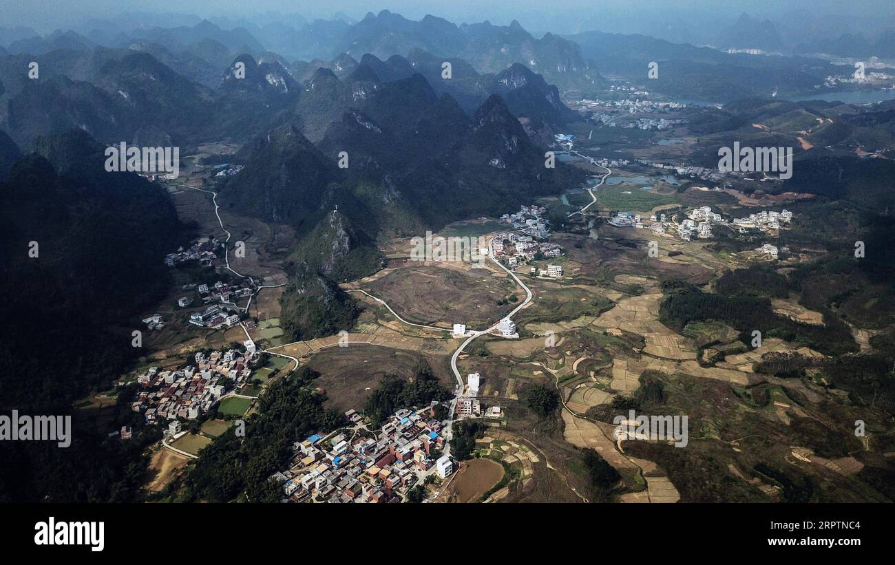 200417 -- NANNING, April 17, 2020 -- Aerial photo taken on Dec. 5, 2017 shows rural roads in Sirong Township of Rongshui Miao Autonomous County, south China s Guangxi Zhuang Autonomous Region. Though bordering the wealthy Guangdong Province and boasting a coastline of 1,500 kilometers, Guangxi Zhuang Autonomous Region is a mountainous region and has long been plagued by poverty. Transport difficulties remained a major impediment to rural development, mainly in mountain-locked rural areas in Guangxi. Inadequate road access was common, and most of the time people had to walk. Many roads were eit Stock Photo