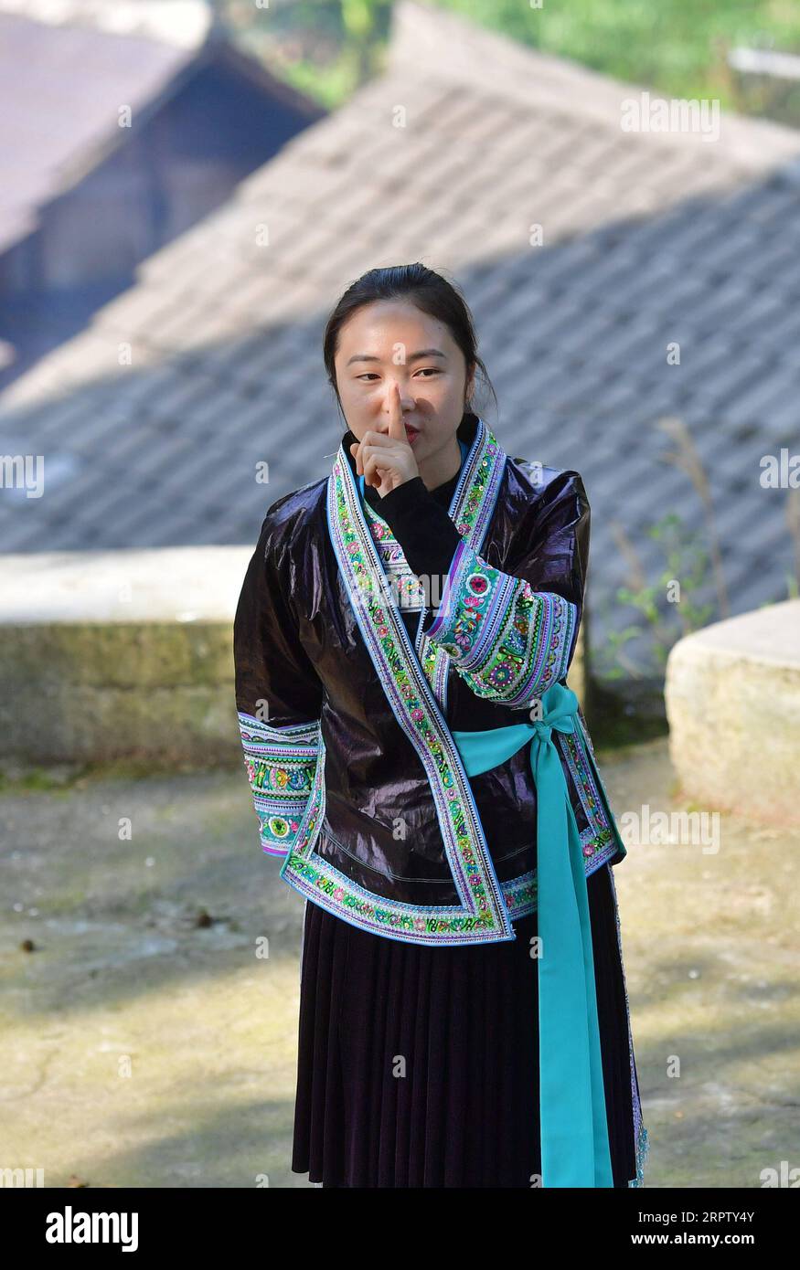 200419 -- RONGSHUI, April 19, 2020 -- Liang Mengxiang teaches Mandarin to local women during a Mandarin training class held in Wuying, a village of Miao ethnic group on the border of south China s Guangxi Zhuang Autonomous Region and southwest China s Guizhou Province, April 16, 2020. Liang Mengxiang, 21, is a college student of Miao ethnic group born in Dangjiu Village, who studies at south China s Guangxi Science and Technology Normal University. Dangjiu is a remote, poverty-stricken village where women over 40 years old hardly ever attended any school, which was believed to be one of the ma Stock Photo