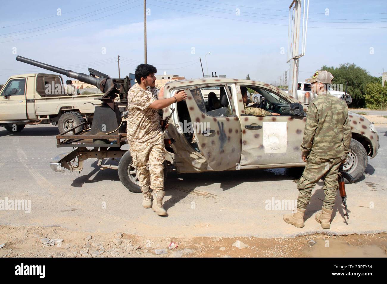 200419 -- TRIPOLI, April 19, 2020 Xinhua -- Fighters of the UN-backed Government of National Accord GNA are seen in Tarhuna, some 90 kilometers south of the capital Tripoli, Libya, April 18, 2020. The UN-backed Libyan government said Saturday it launched a massive attack on the rival east-based army in Tarhuna city, killing eight soldiers of the army and capturing more than 100 others. The government s forces said they launched 17 airstrikes on the east-based army positions in Tarhuna, seizing a number of military vehicles. Photo by Hamza Turkia/Xinhua LIBYA-TRIPOLI-ATTACK PUBLICATIONxNOTxINxC Stock Photo