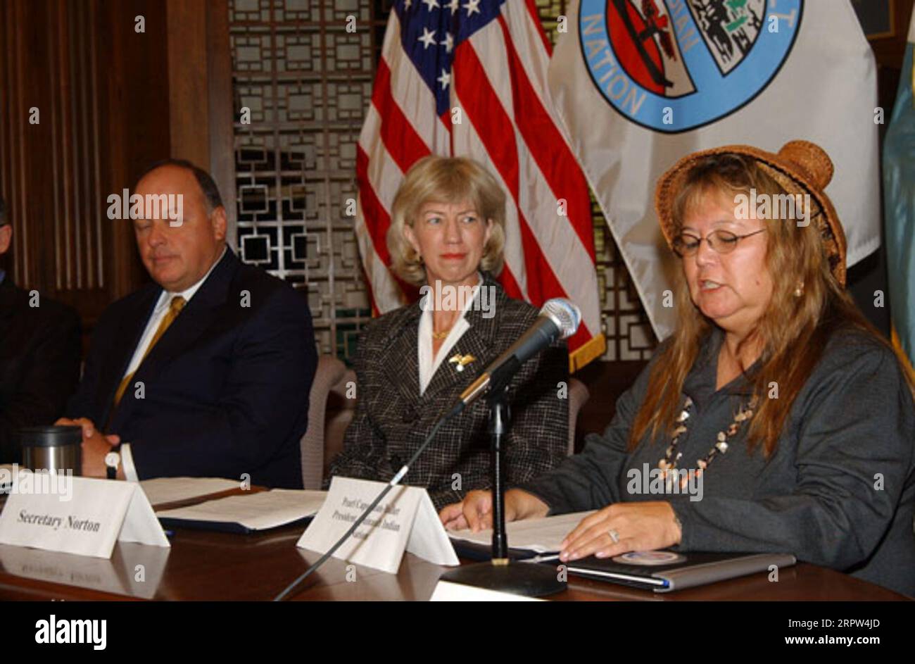 Assistant Attorney General for Environmental and Natural Resources, Thomas Sansonetti, Secretary Gale Norton, and President of the Quinault Indians, Pearl Capoeman-Baller, left to right, at signing event for agreement protecting forest habitat of marbled murrelet and other species in Washington state Stock Photo