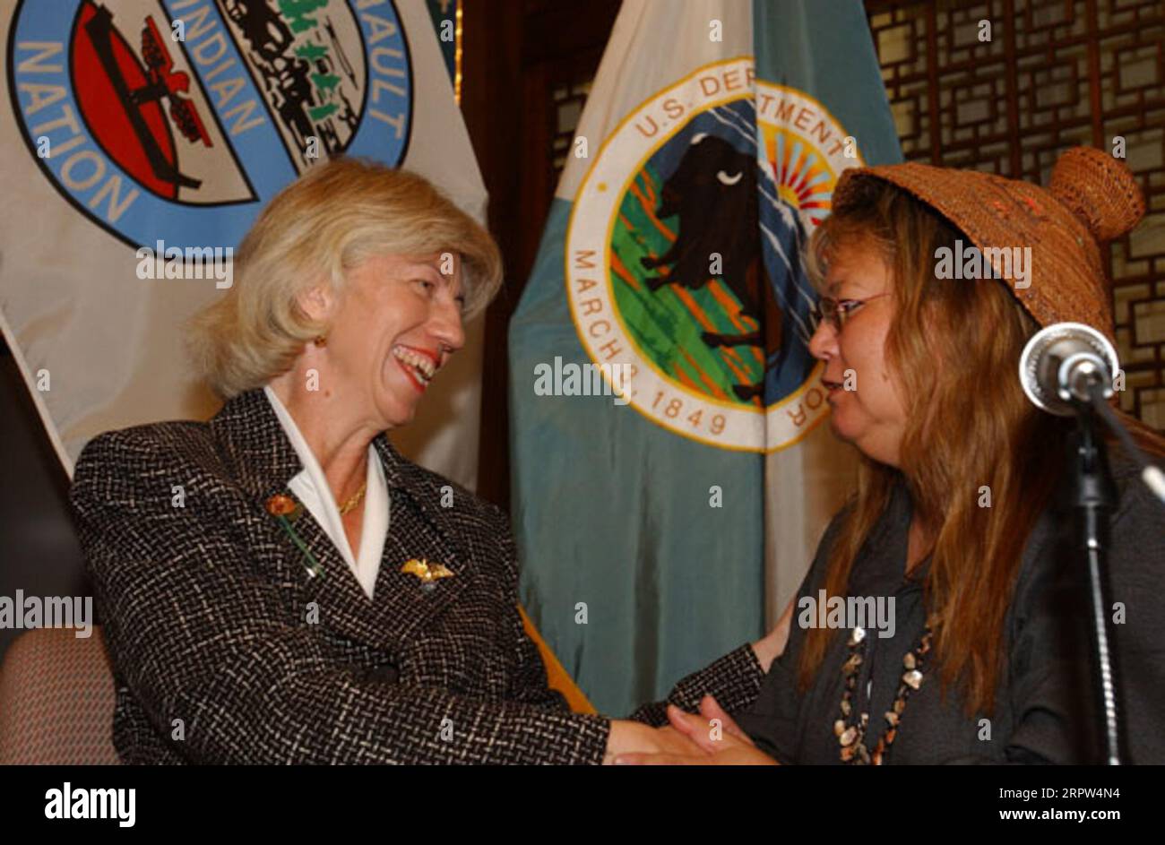 Secretary Gale Norton with the President of the Quinault Indian Nation, Pearl Capoeman-Baller, left to right, at Department of Interior headquarters signing event for agreement protecting forest habitat of marbled murrelet and other species on Quinault Reservation land in Washington state Stock Photo