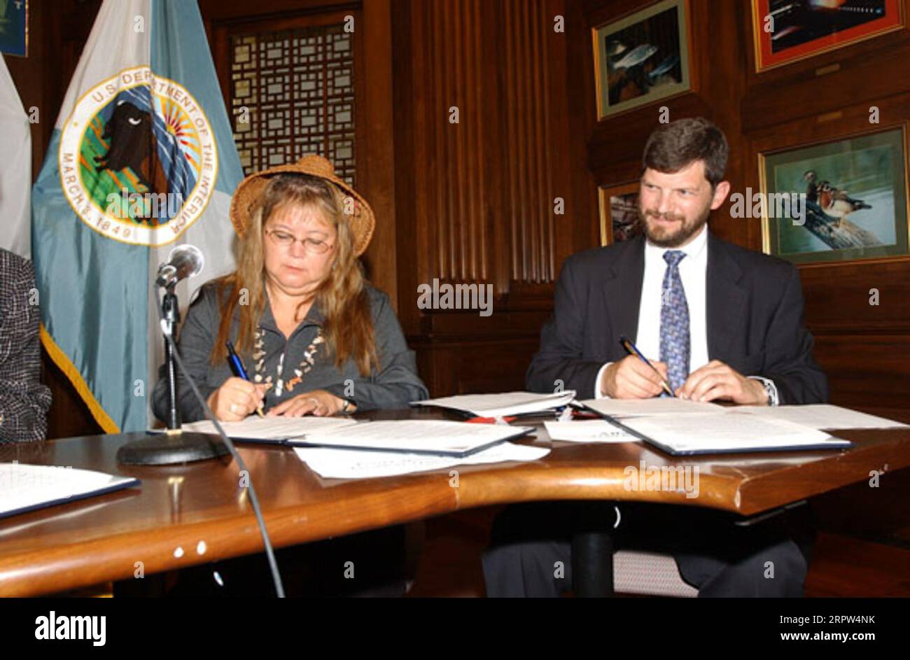 President of the Quinault Indian Nation, Pearl Capoeman-Baller, and Senior Vice President of Trust for Public Land, Alan Front, left to right, at Department of Interior headquarters signing event for agreement protecting forest habitat of marbled murrelet on Quinault Reservation land in Washington state Stock Photo